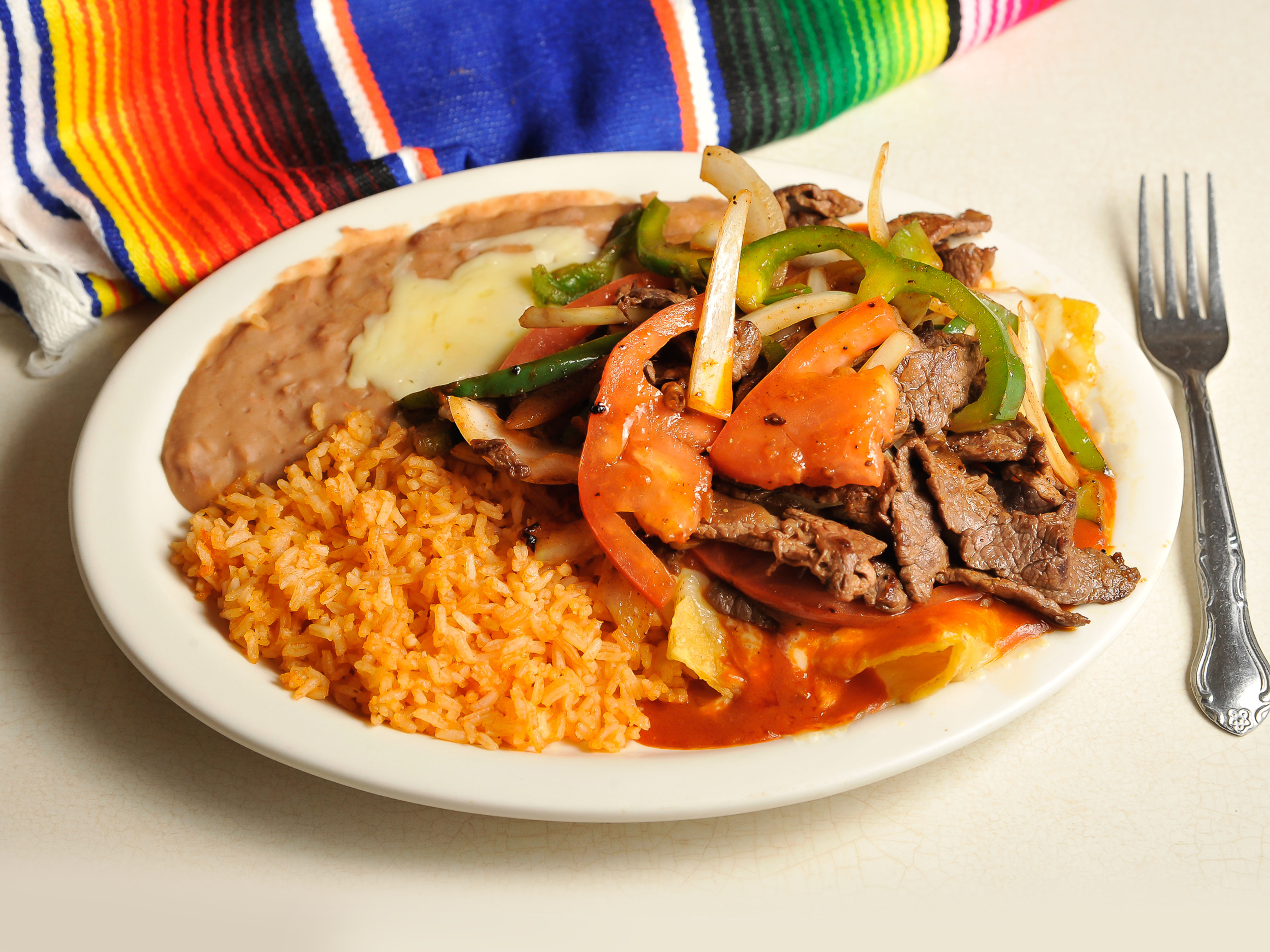 Order Fajita Enchiladas food online from Don Chuchos Mexican Restaurant store, Columbus on bringmethat.com