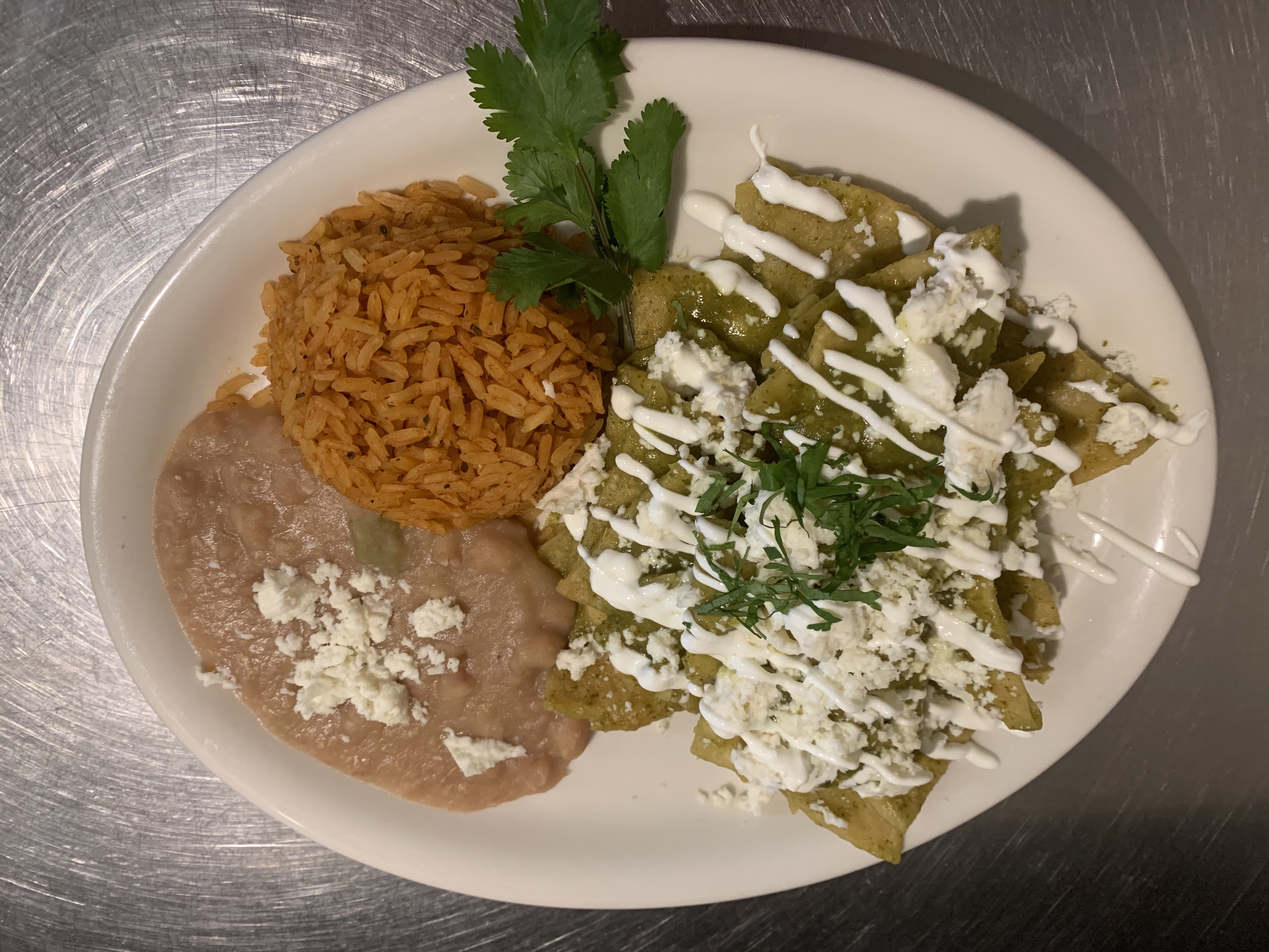 Order CHILAQUILES WITH EGGS.  GREEN SAUCE food online from Polaris Street Cafe store, Las Vegas on bringmethat.com