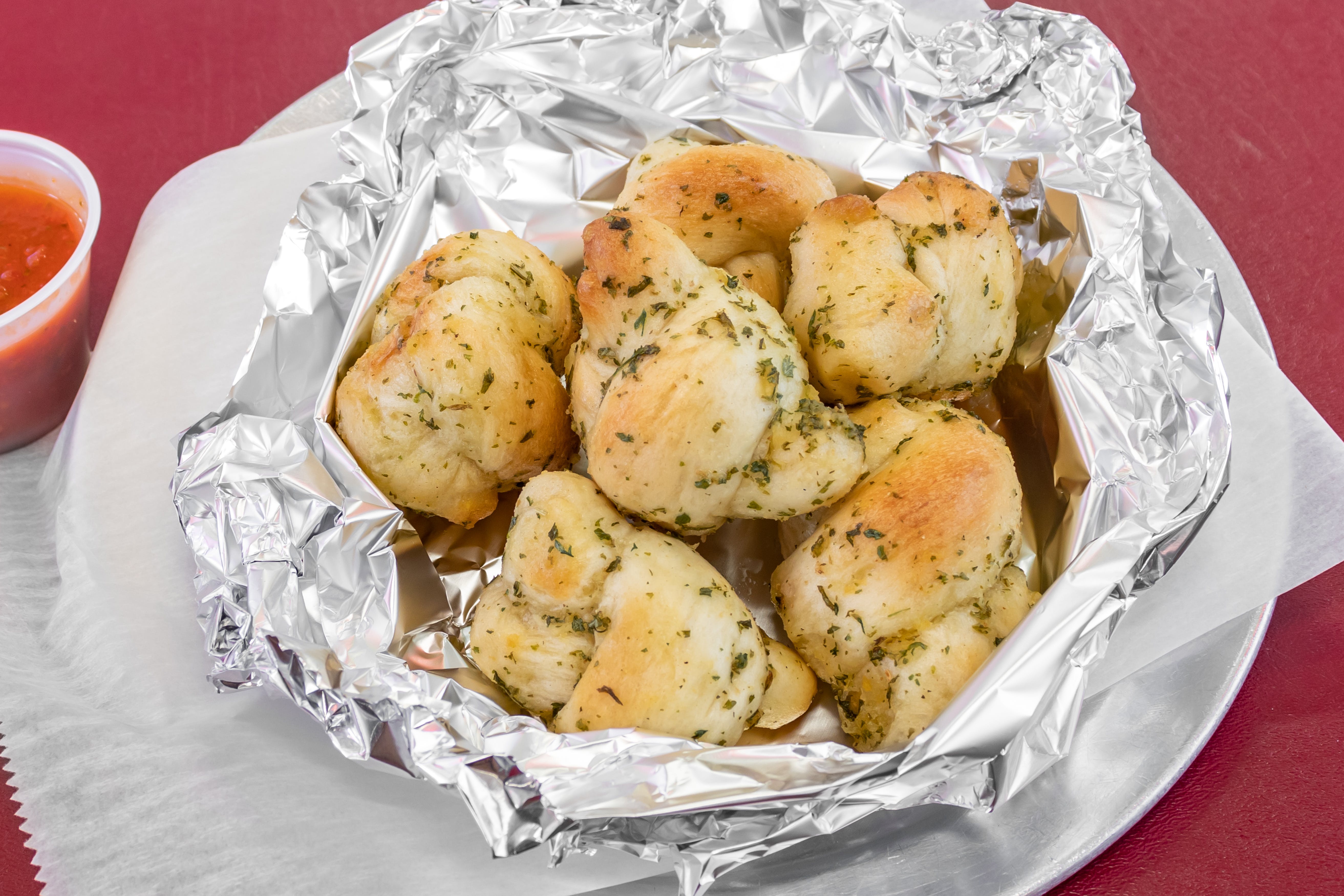Order Garlic Knots - 12 Pieces food online from 3 Boys From Italy store, West Haverstraw on bringmethat.com