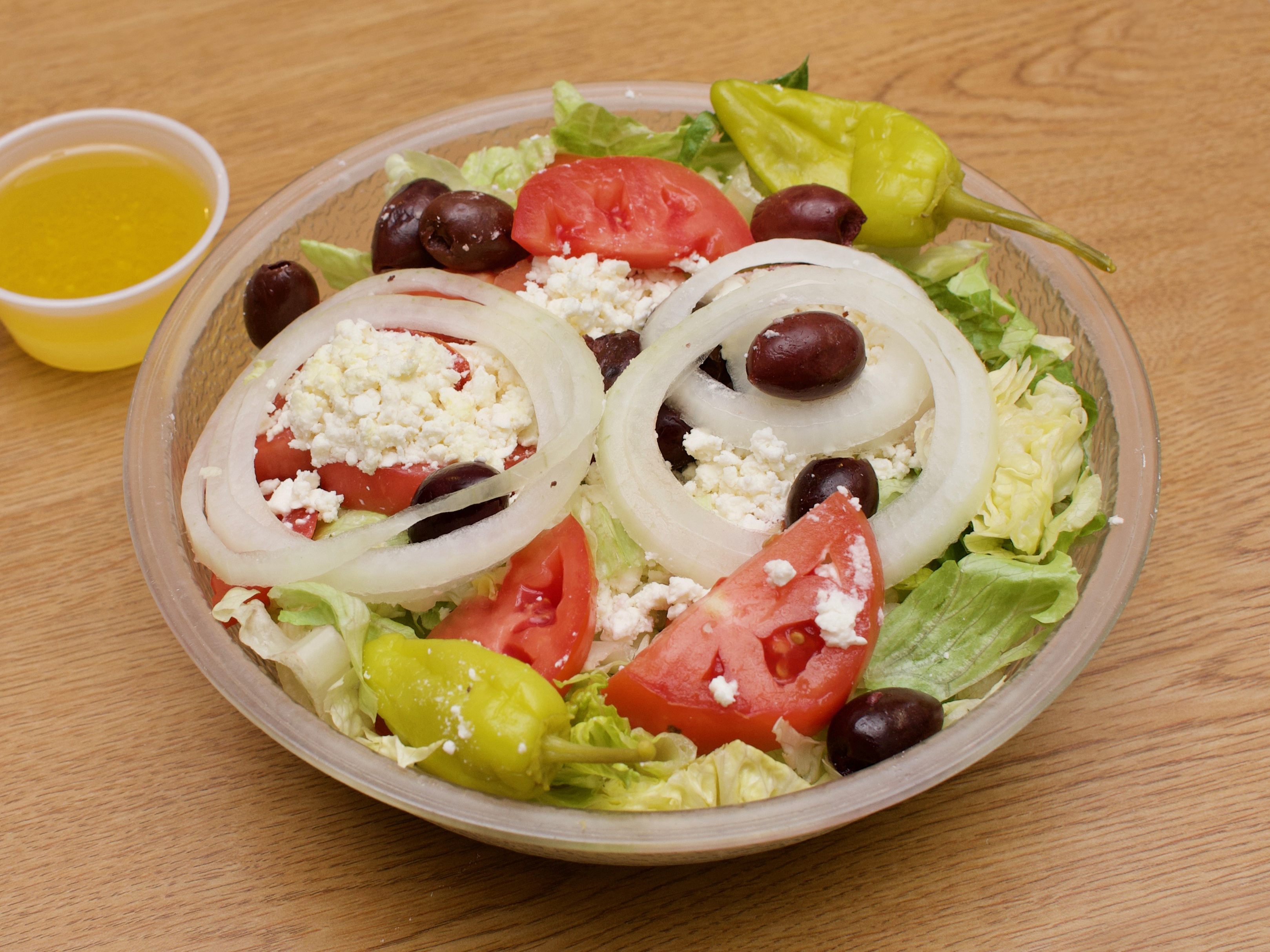 Order Greek Salad food online from Fairlington Pizza Carry Out store, Alexandria on bringmethat.com