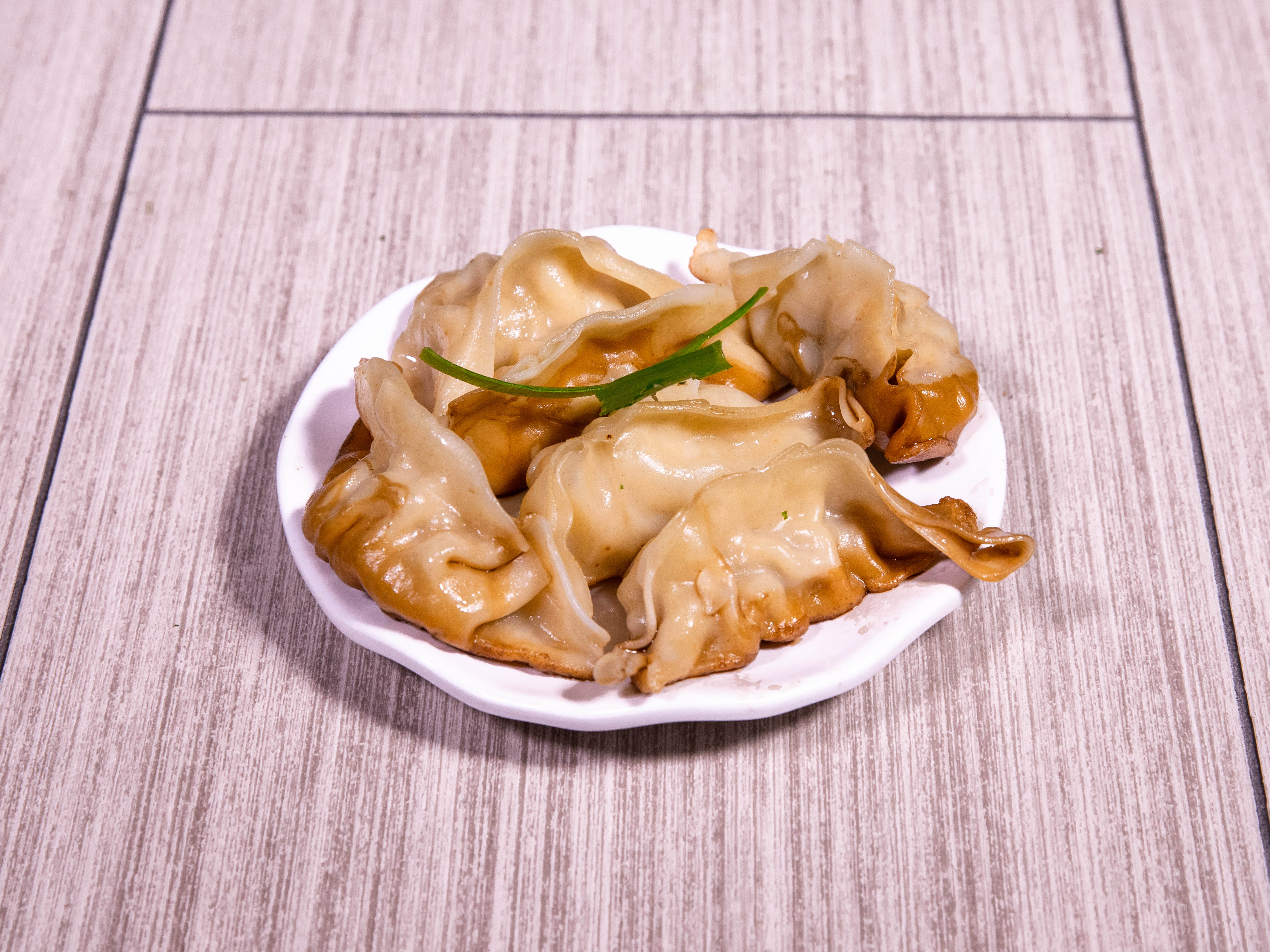 Order A16. Pot Stickers food online from Meso Asia store, Frisco on bringmethat.com
