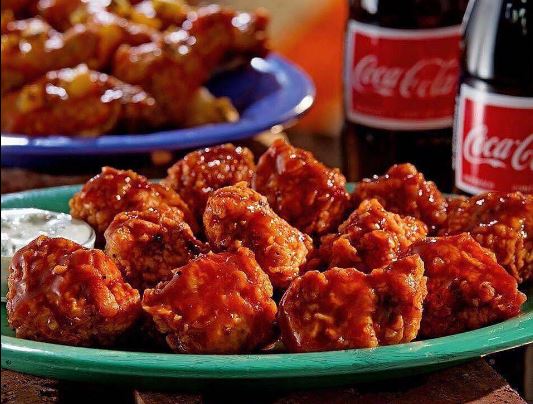 Order 12 Wings food online from Ojos Locos Sports Cantina store, Houston on bringmethat.com