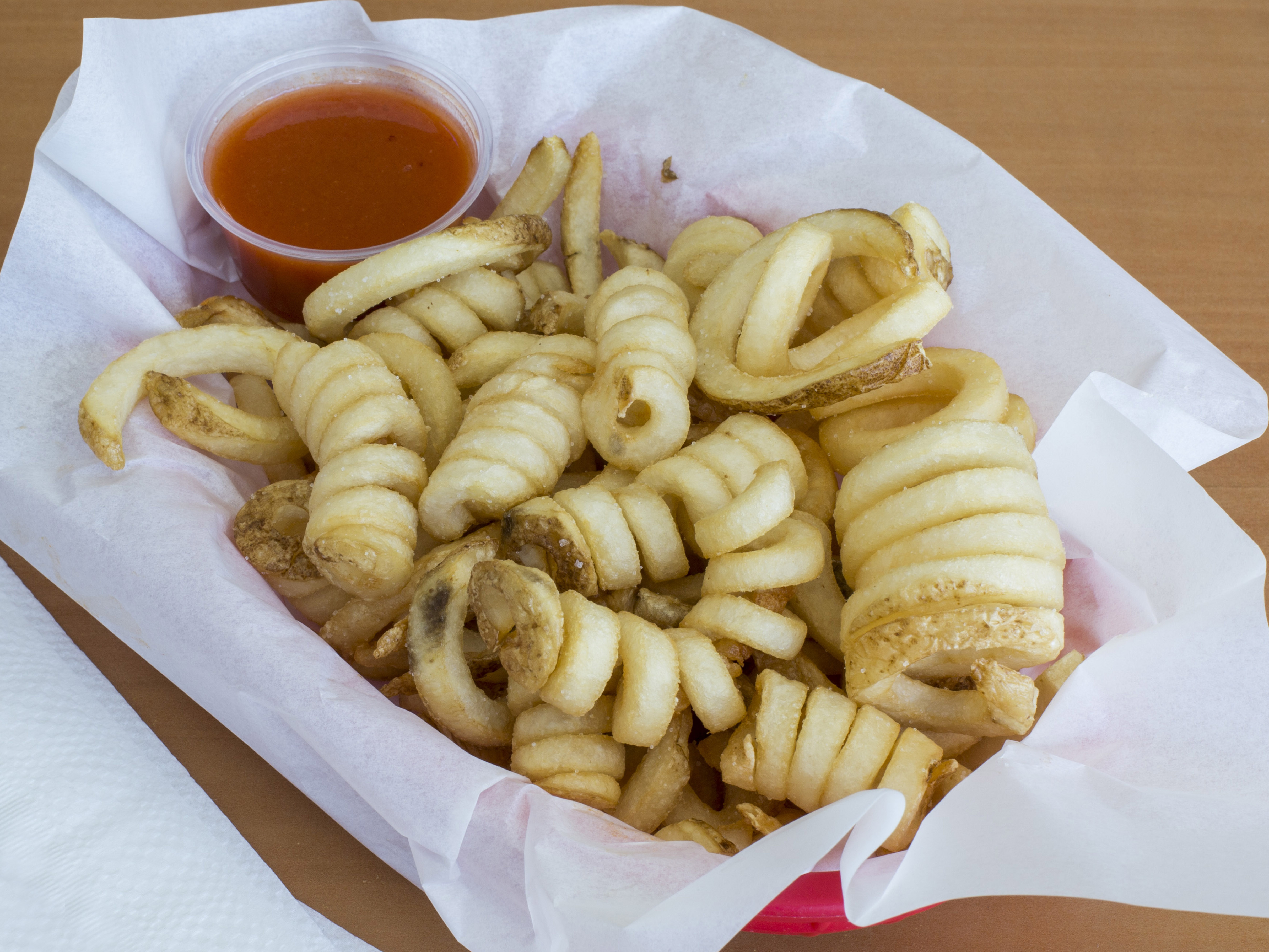 Order Curly Fries food online from Hot Wings Cafe store, Pasadena on bringmethat.com