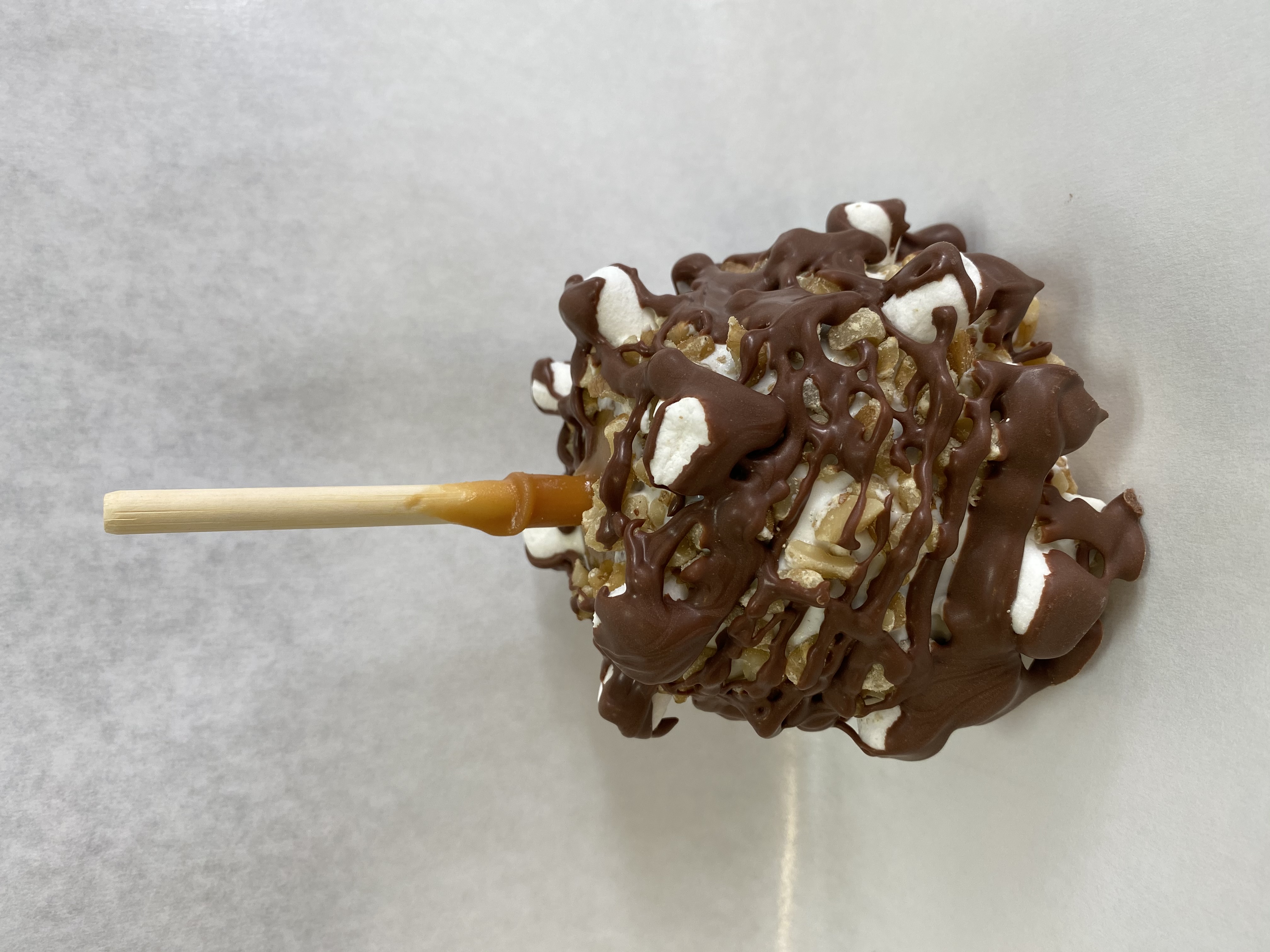 Order Rocky Road Caramel Apple food online from Rocky Mountain Chocolate Factory store, Irvine on bringmethat.com
