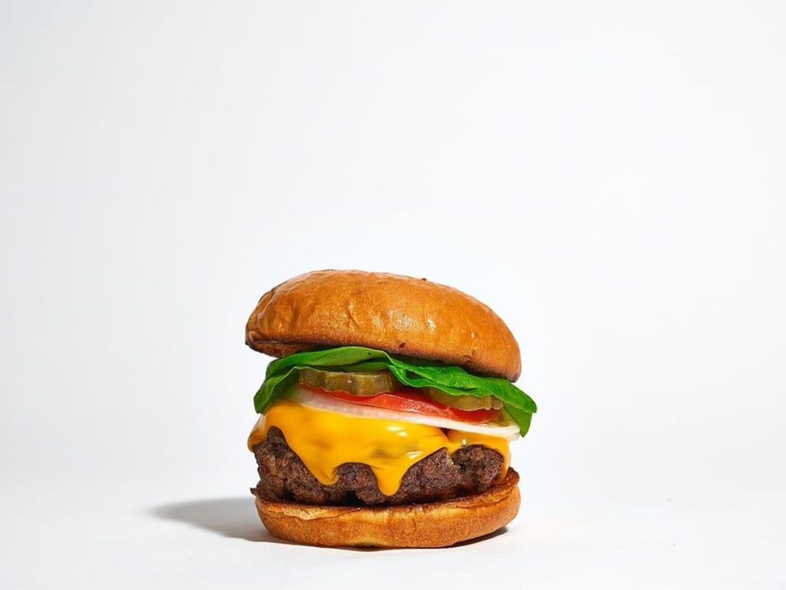 Order Calamitous Cheddar Burger (Cheese Burger) food online from Cheat Day Cafe store, Lakewood on bringmethat.com