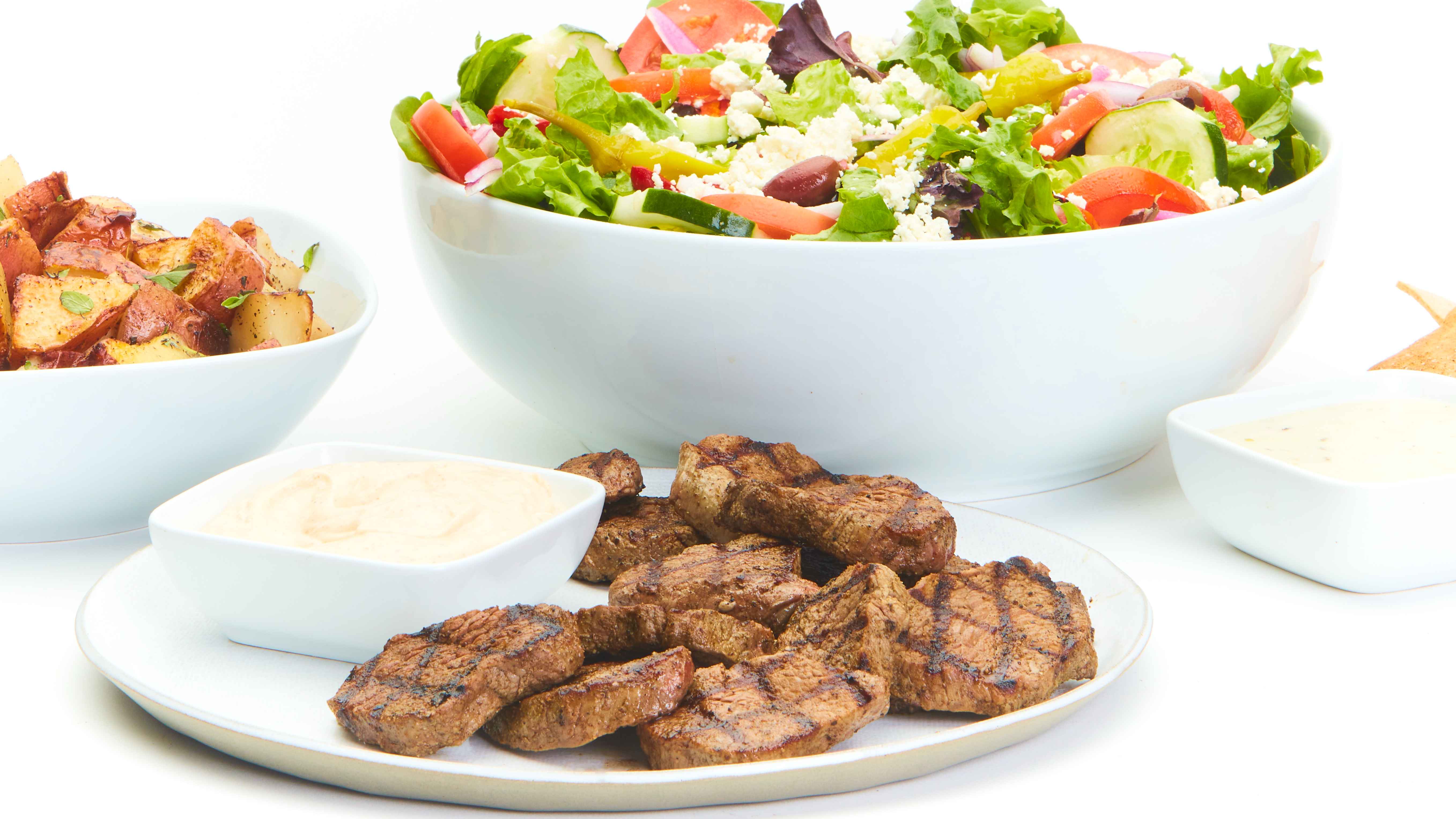 Order Grilled Beef Feast for 4 food online from Taziki's Mediterranean Cafe store, Charlotte on bringmethat.com
