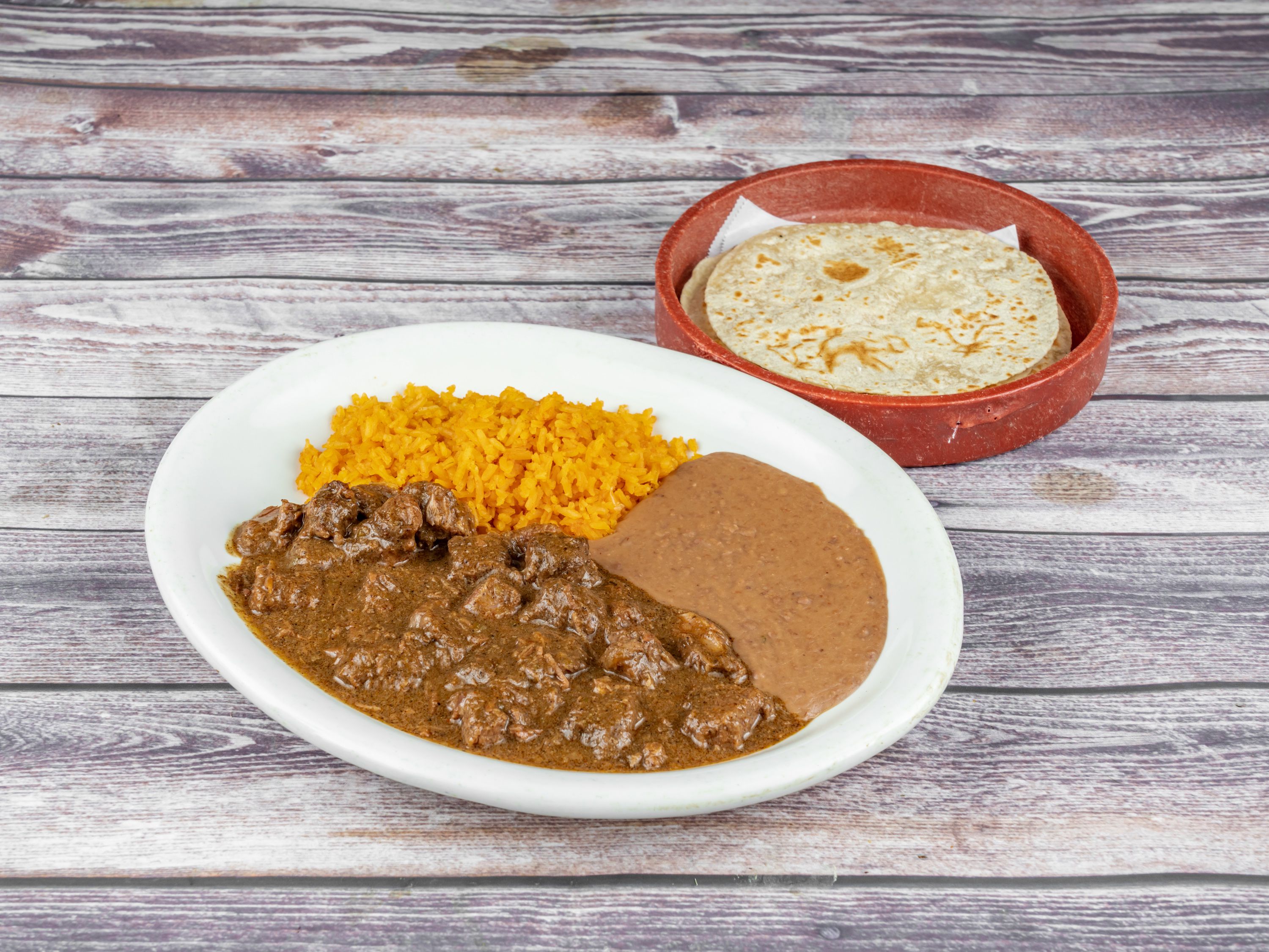 Order Carne Guisada food online from Tequila Lopez Mexican Restaurant store, Houston on bringmethat.com