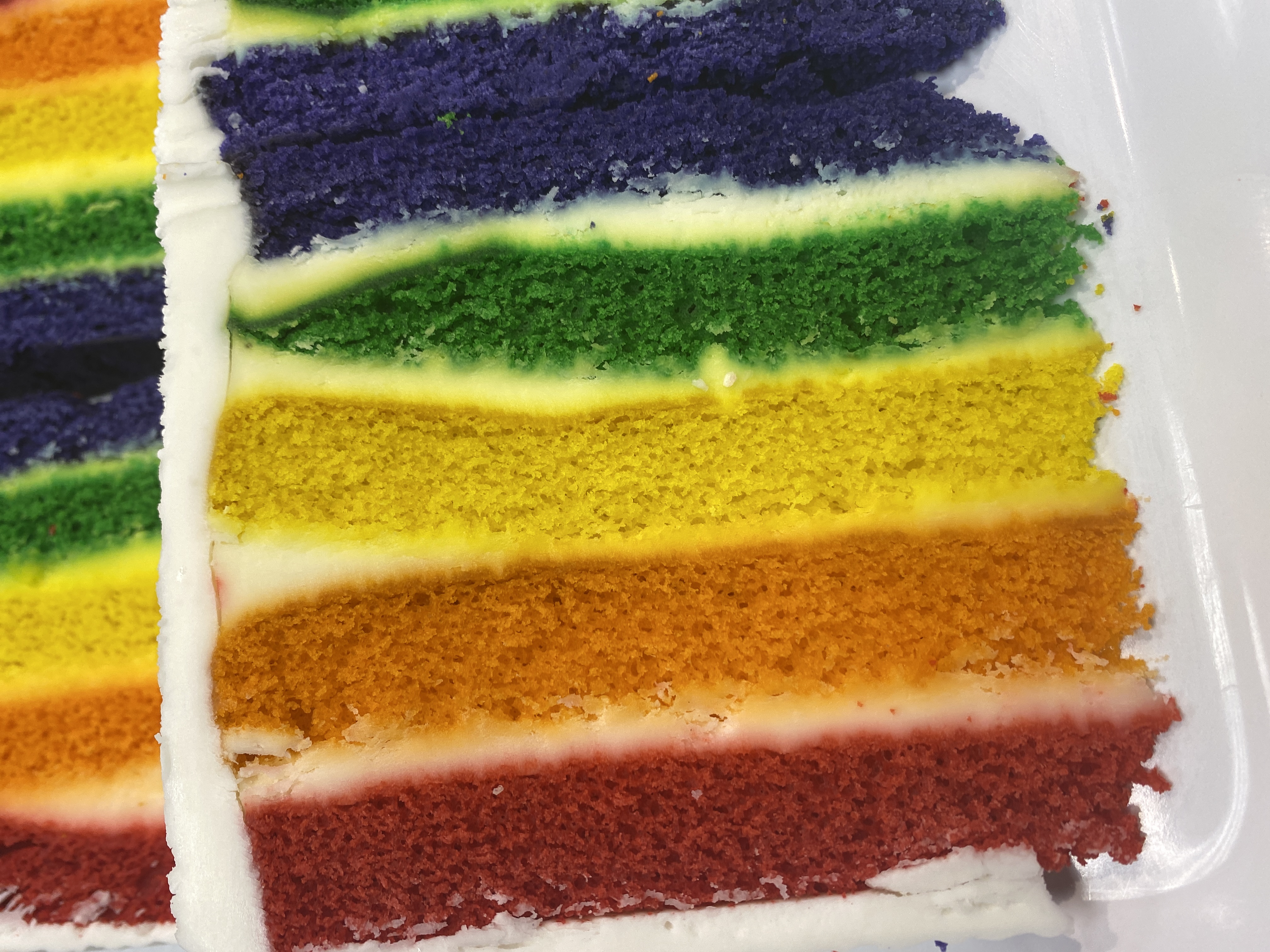 Order Rainbow Cake food online from Cravings Dessert Lounge store, Ypsilanti on bringmethat.com