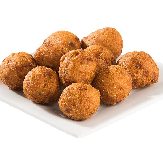 Order Hushpuppies - 24 pc food online from Champs Chicken store, Eagle Pass on bringmethat.com