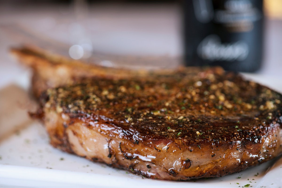 Order Bone-in Cowboy Ribeye, 22 OZ* | GF food online from Perry Steakhouse & Grille store, Grapevine on bringmethat.com