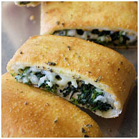 Order Garlic Spinach Stromboli food online from DoubleDave's Pizzaworks store, Denton on bringmethat.com