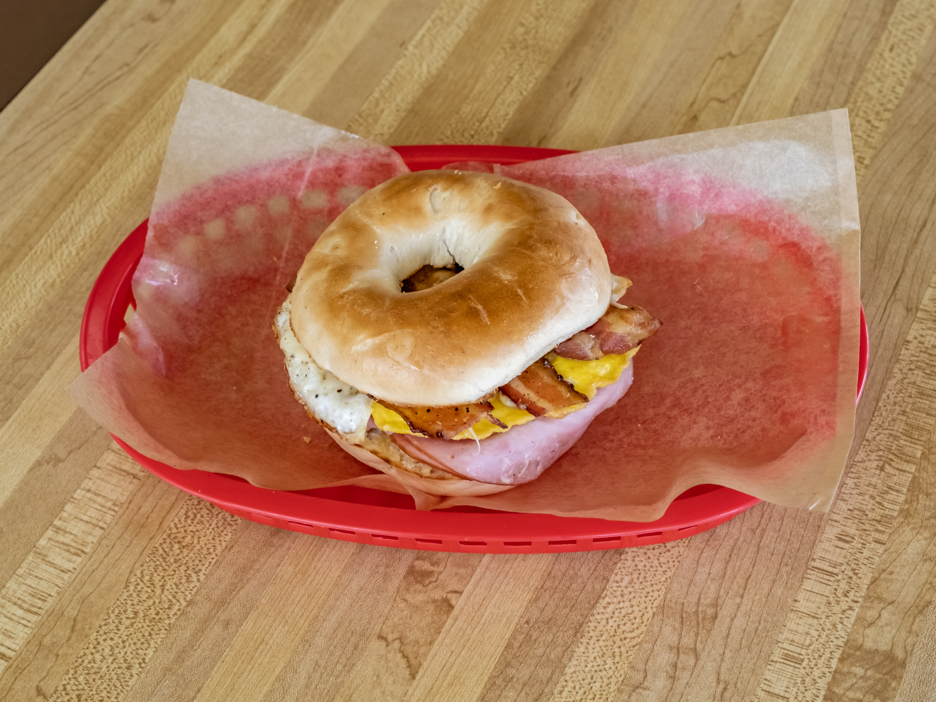 Order #7. Ham, Egg, Bacon and cheese. Bagel 說 food online from Donut Plus store, Orange on bringmethat.com