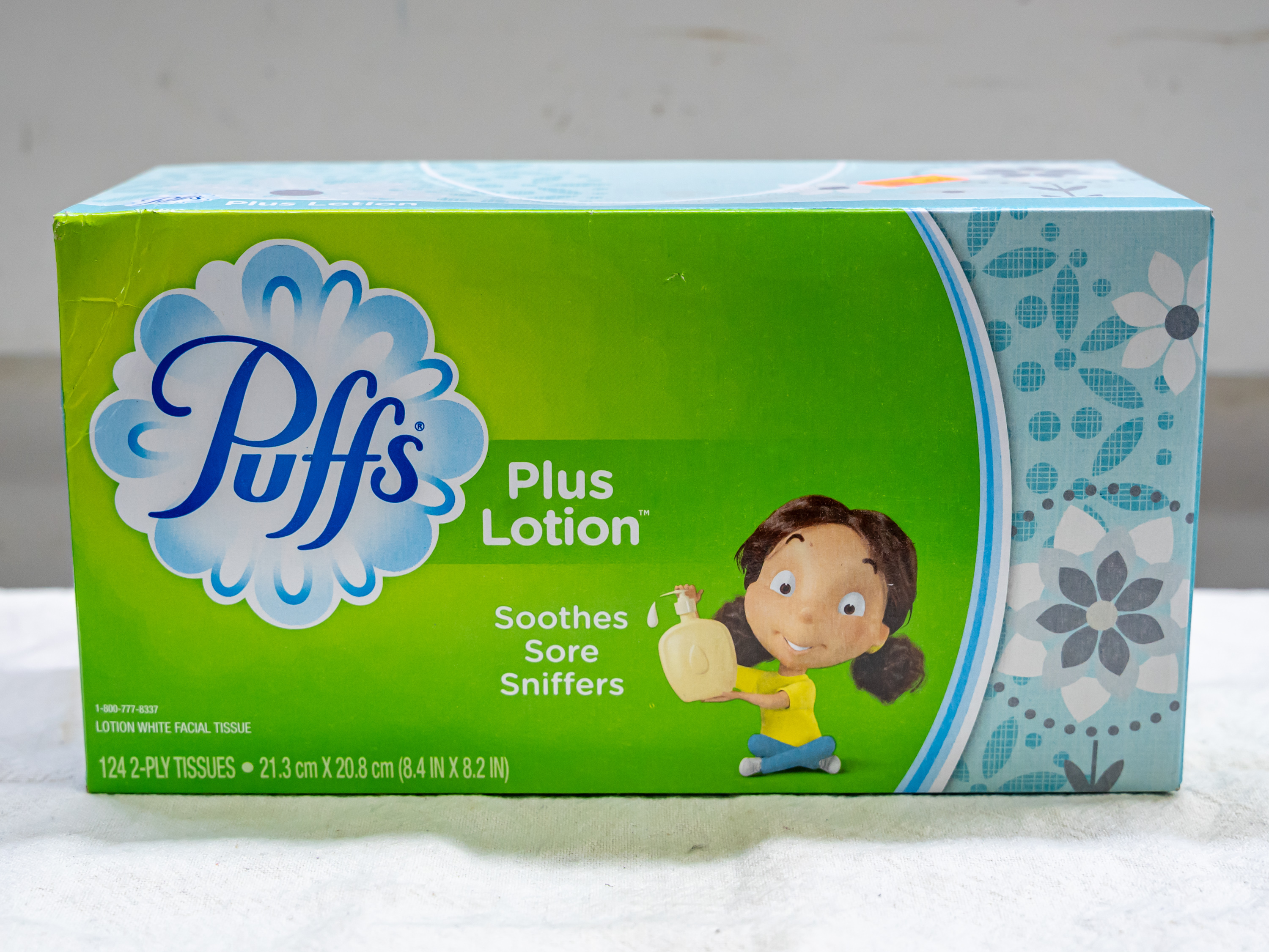 Order Puffs plus Lotion Tissue  box ( 124 pc) food online from Quentin Deli and Grocery store, Brooklyn on bringmethat.com
