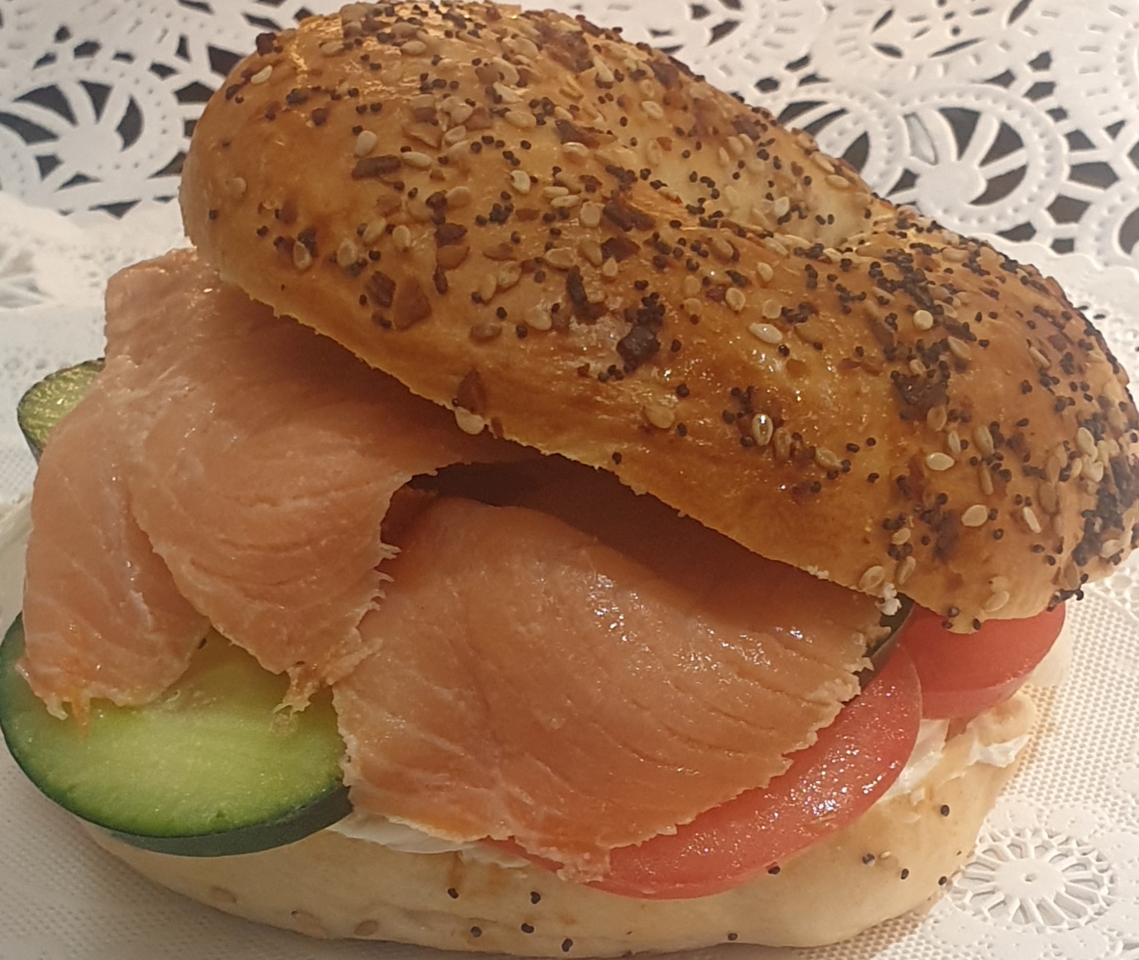 Order 8B-Smoked Salmon and Cream Cheese w/ Capers & Tomatoes on a Bagel food online from Taz Cafe store, New York on bringmethat.com