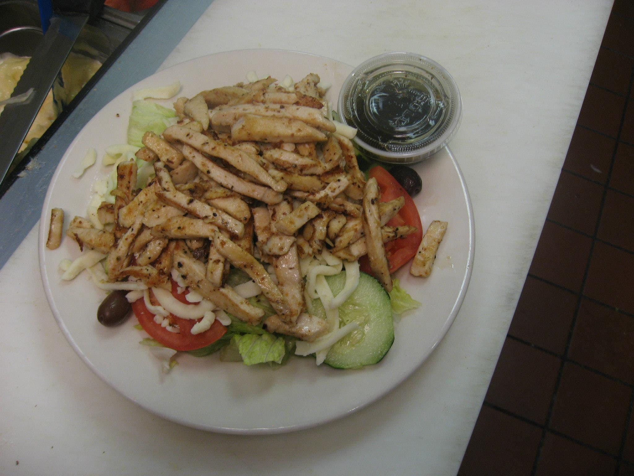 Order Grilled Chicken Salad - Salad food online from Merone's Buon Appetito NY Pizza store, Chantilly on bringmethat.com