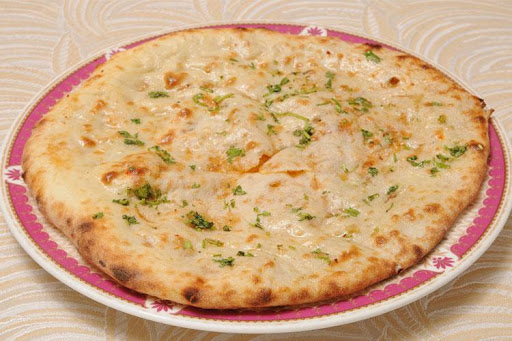 Order Onion Kulcha food online from King of Tandoor Fine Indian Restaurant store, Philadelphia on bringmethat.com