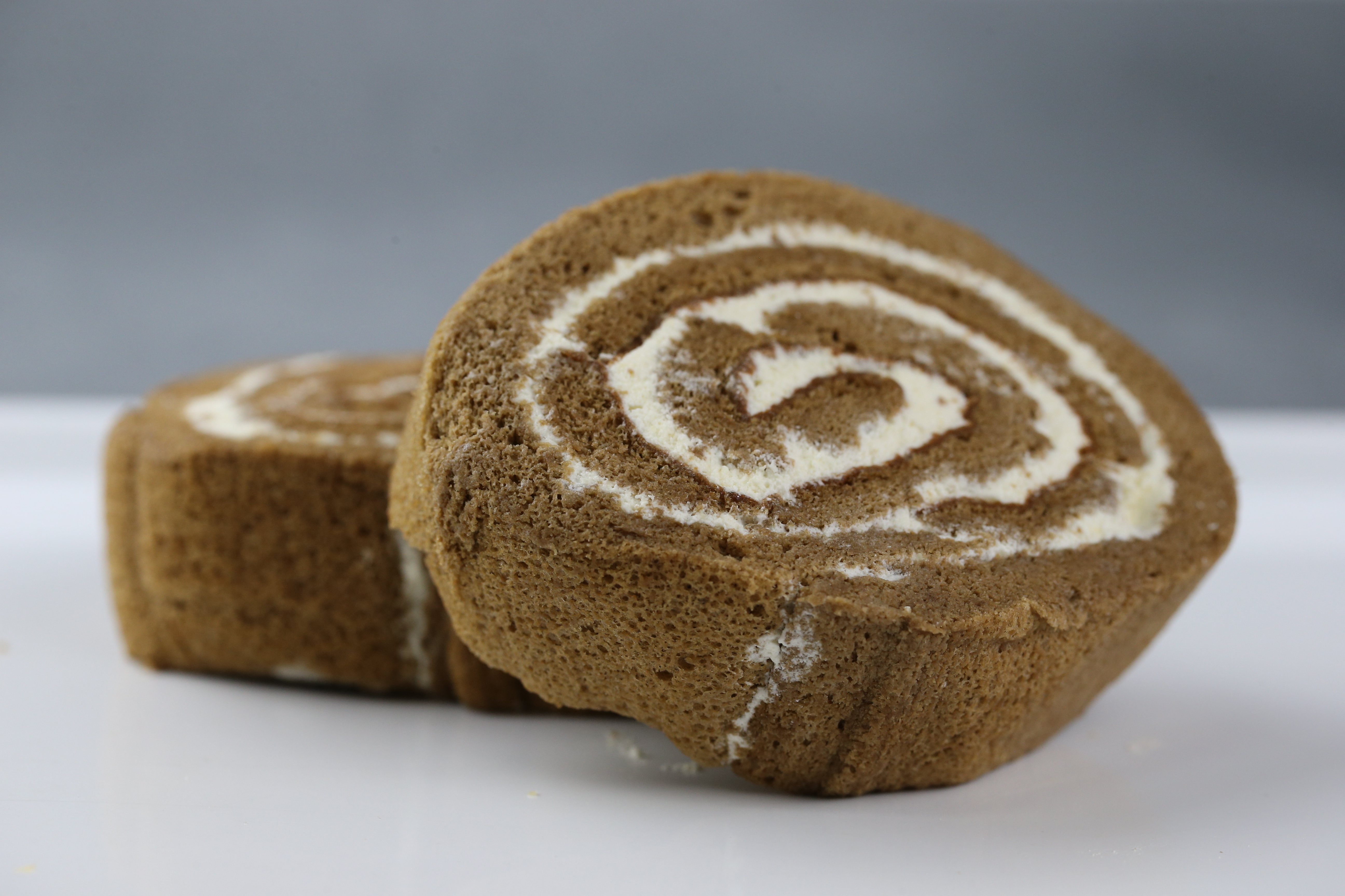 Order 2 Slice of Mocha Swiss Roll food online from Cherry Blossom Bakery store, San Francisco on bringmethat.com