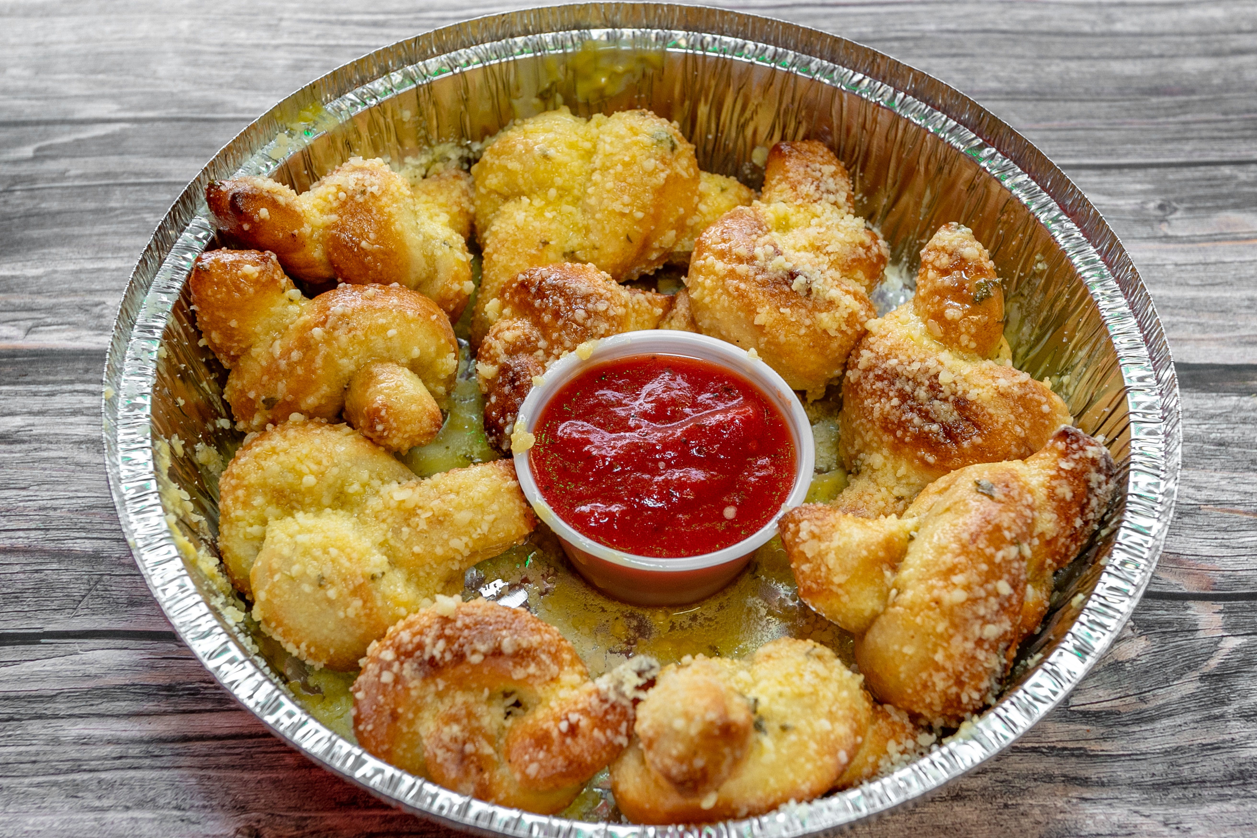 Order Garlic Knots - 10 Pieces food online from Pizza Place store, Adairsville on bringmethat.com