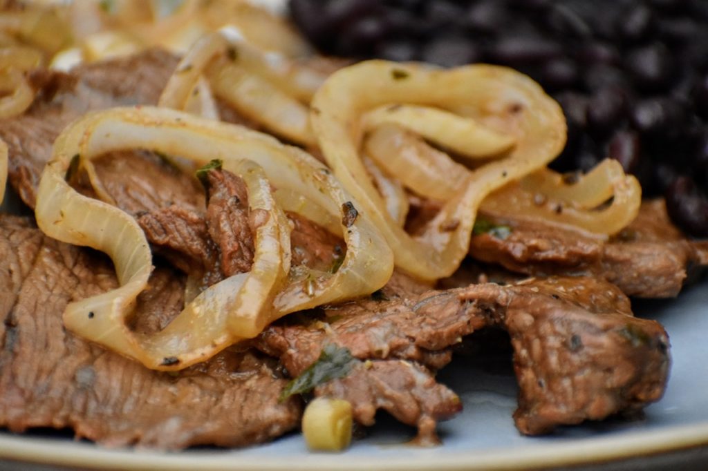 Order Beef with  Onion/ Bistec Encebollado food online from Tu Cocina Restaurant & Bakery store, Lawrence on bringmethat.com