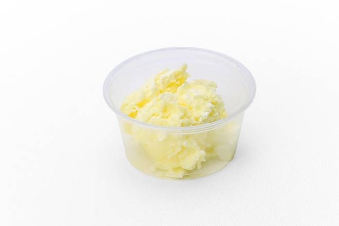 Order Side of Butter food online from Slim Chickens store, Champaign on bringmethat.com