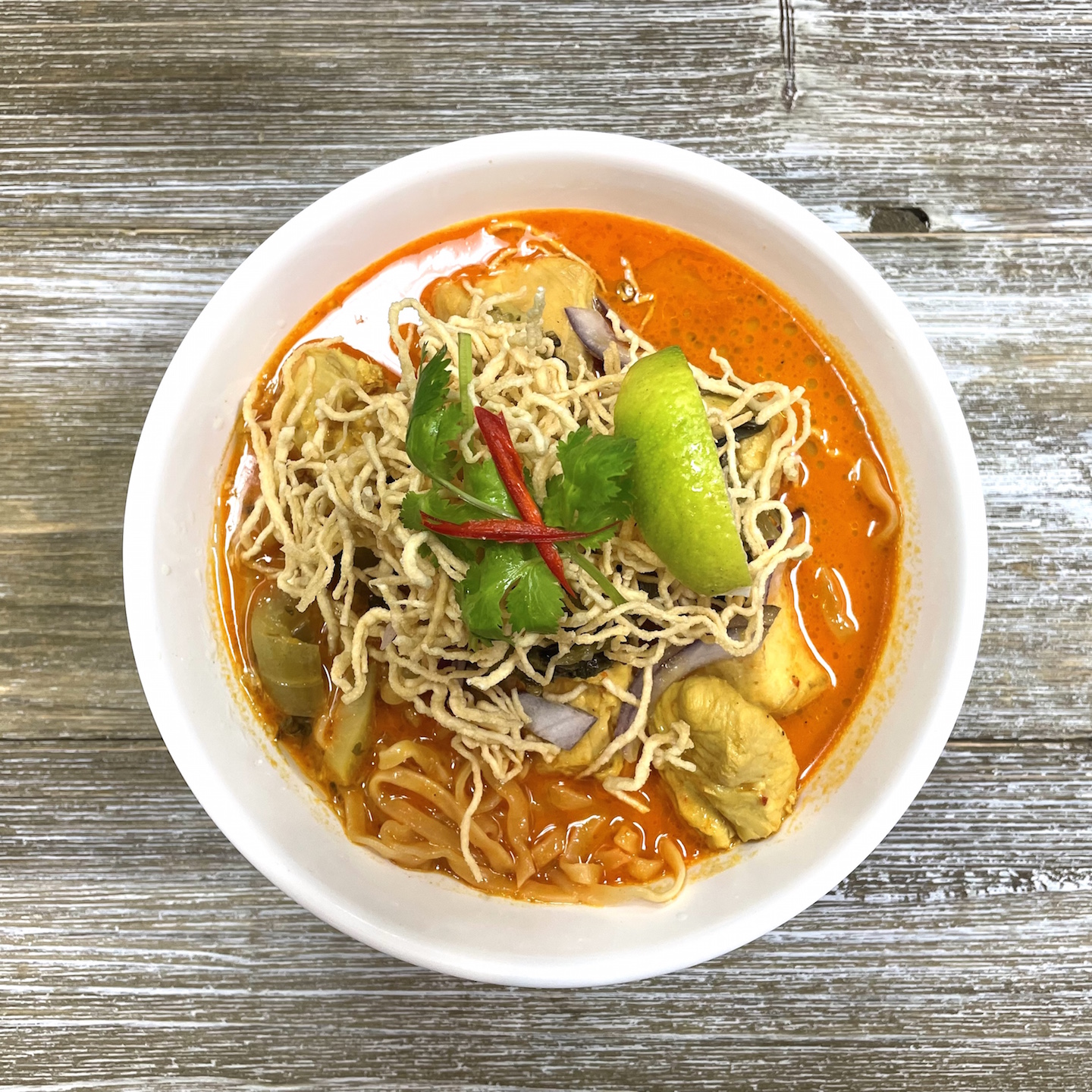 Order Signature Khao Soi Chicken food online from La Ong Thai Bistro store, Herndon on bringmethat.com