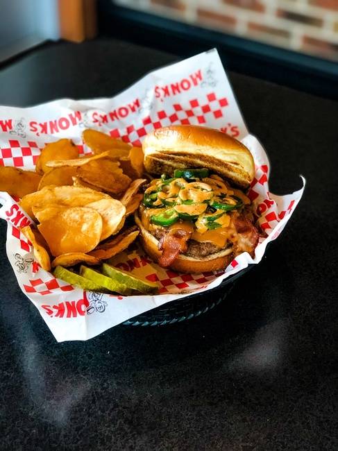 Order Jalapeno Bacon Burger food online from Monk's Bar & Grill store, Middleton on bringmethat.com