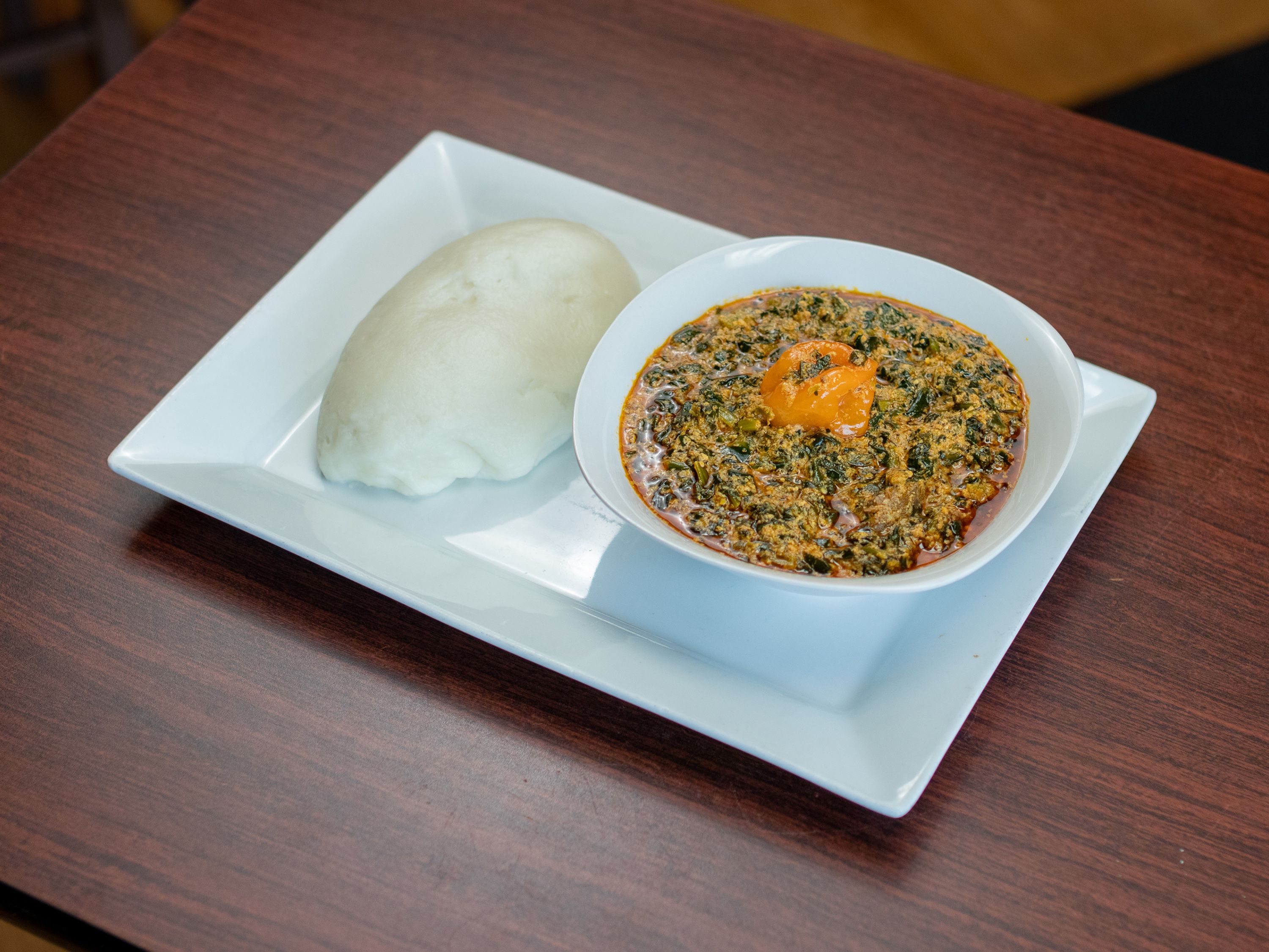 Order Fufu and Tomato Light Soup food online from Chaima Cuisine store, Omaha on bringmethat.com