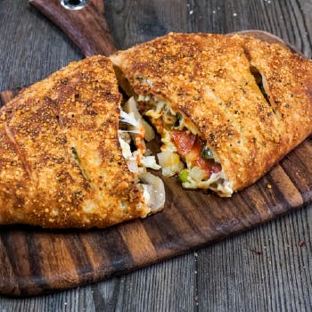 Order Deluxe Stromboli - Small food online from Fox's Pizza Den store, Bay on bringmethat.com