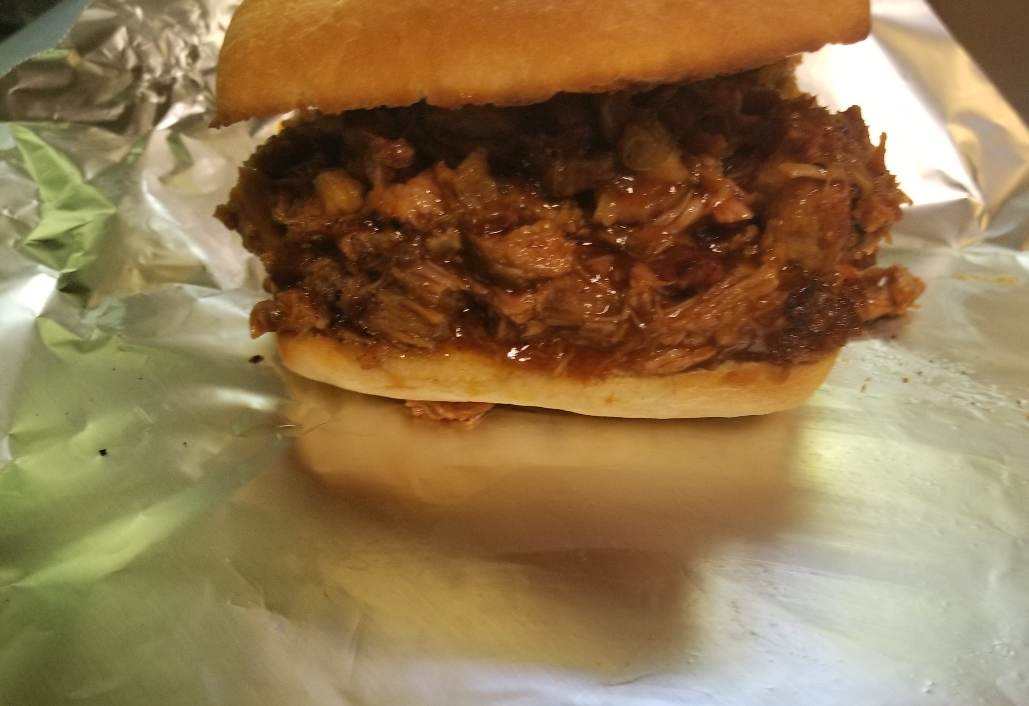 Order Pulled Pork Sandwich - Sandwich food online from Novotny's Groceries & Pizza store, Worthington on bringmethat.com