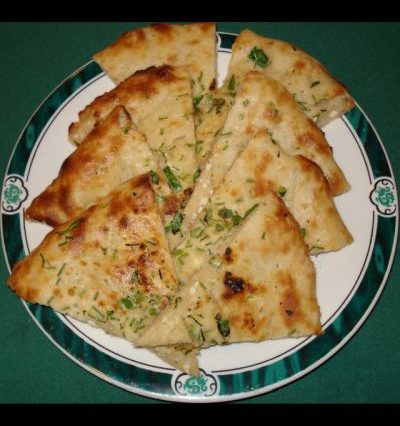 Order Garlic Naan food online from Mughal Oasis Restaurant store, Springfield on bringmethat.com