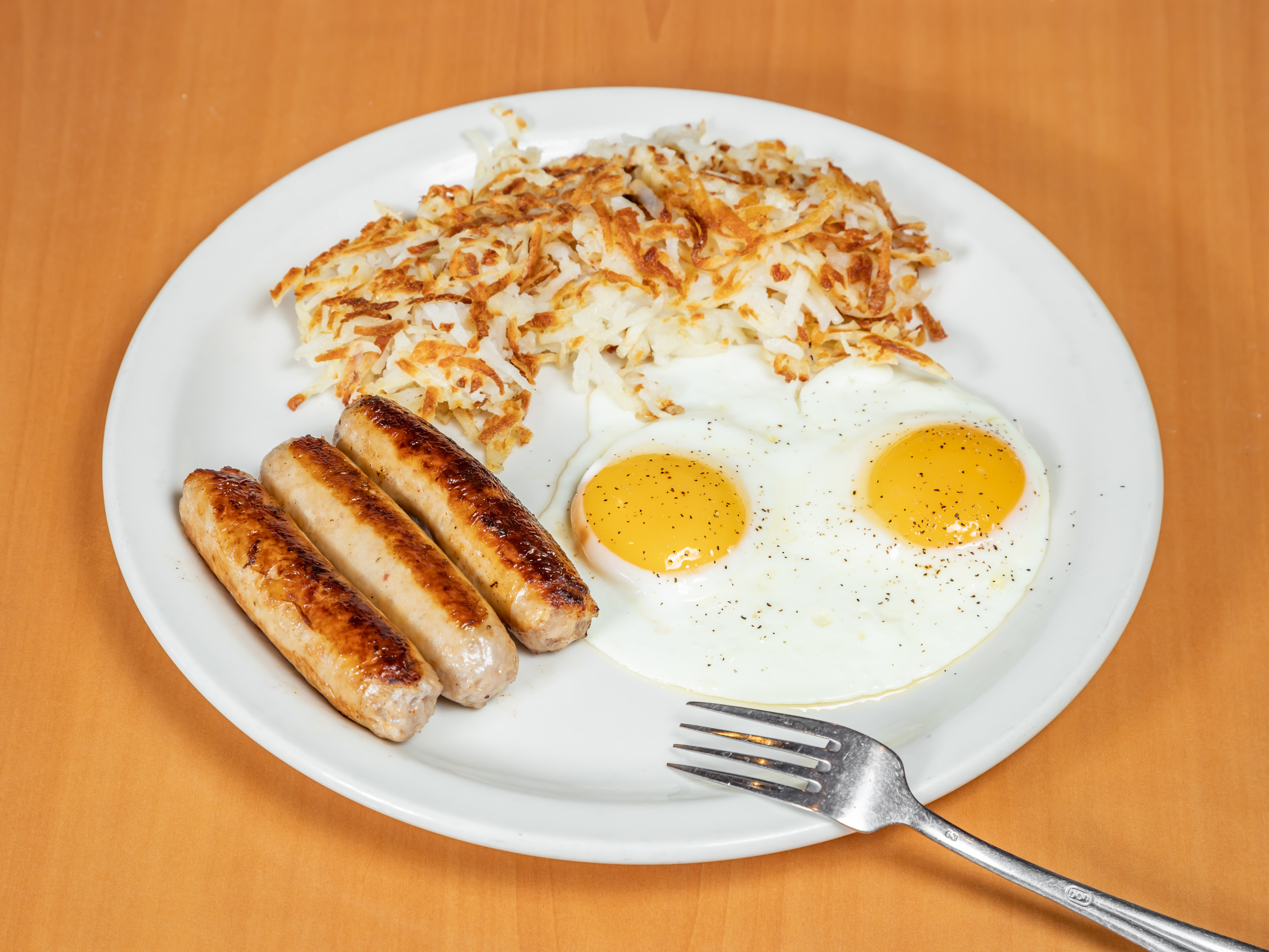 Order 2 Eggs with Plump Sausage links or patties food online from Apple Villa Pancake House store, Batavia on bringmethat.com