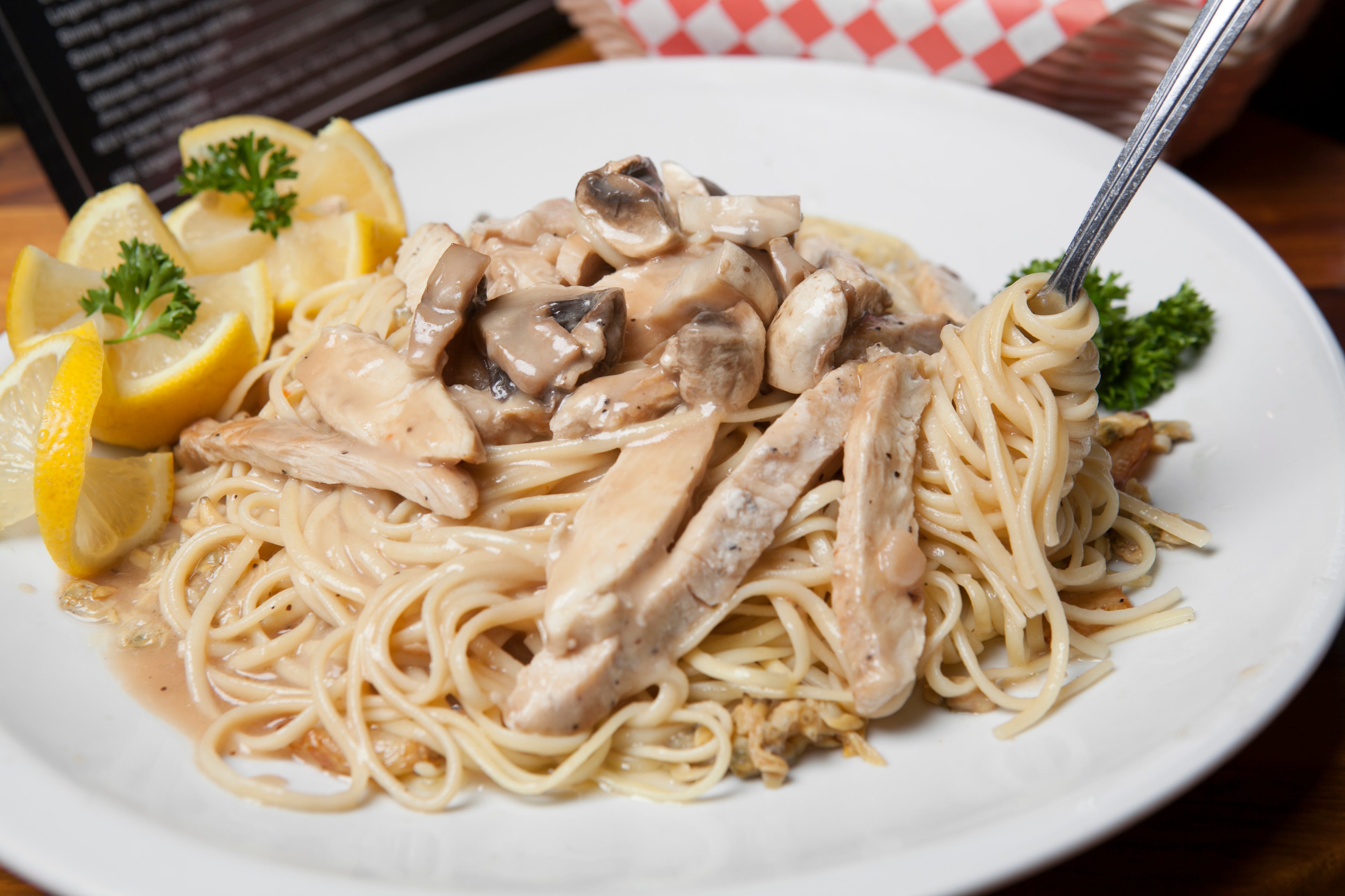 Order Chicken Scalloppine - Entree food online from Lino's Pizzeria and Italian store, North Las Vegas on bringmethat.com