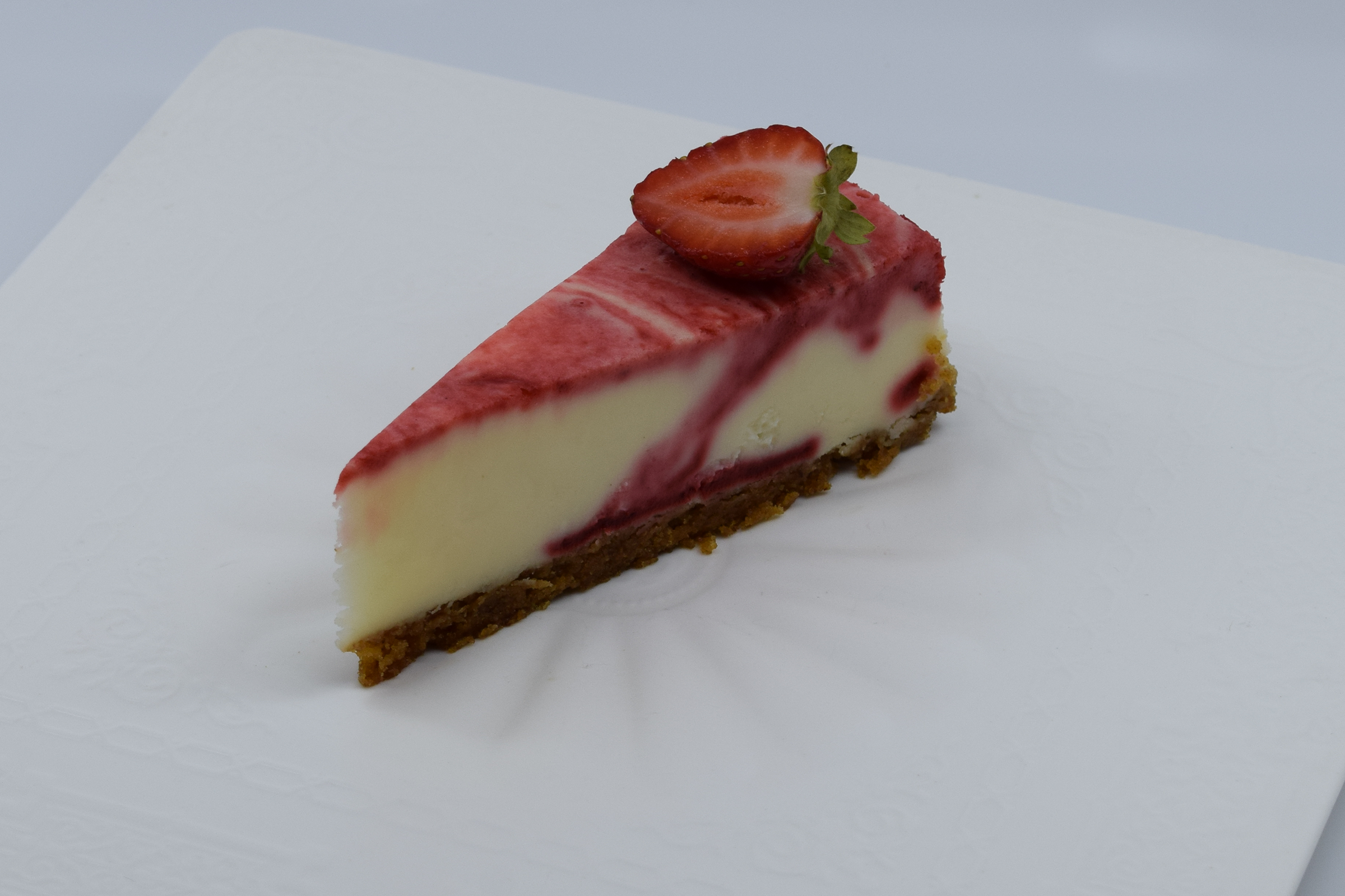 Order Cheesecake Strawberry Swirl food online from Fantastic Desserts store, San Diego on bringmethat.com