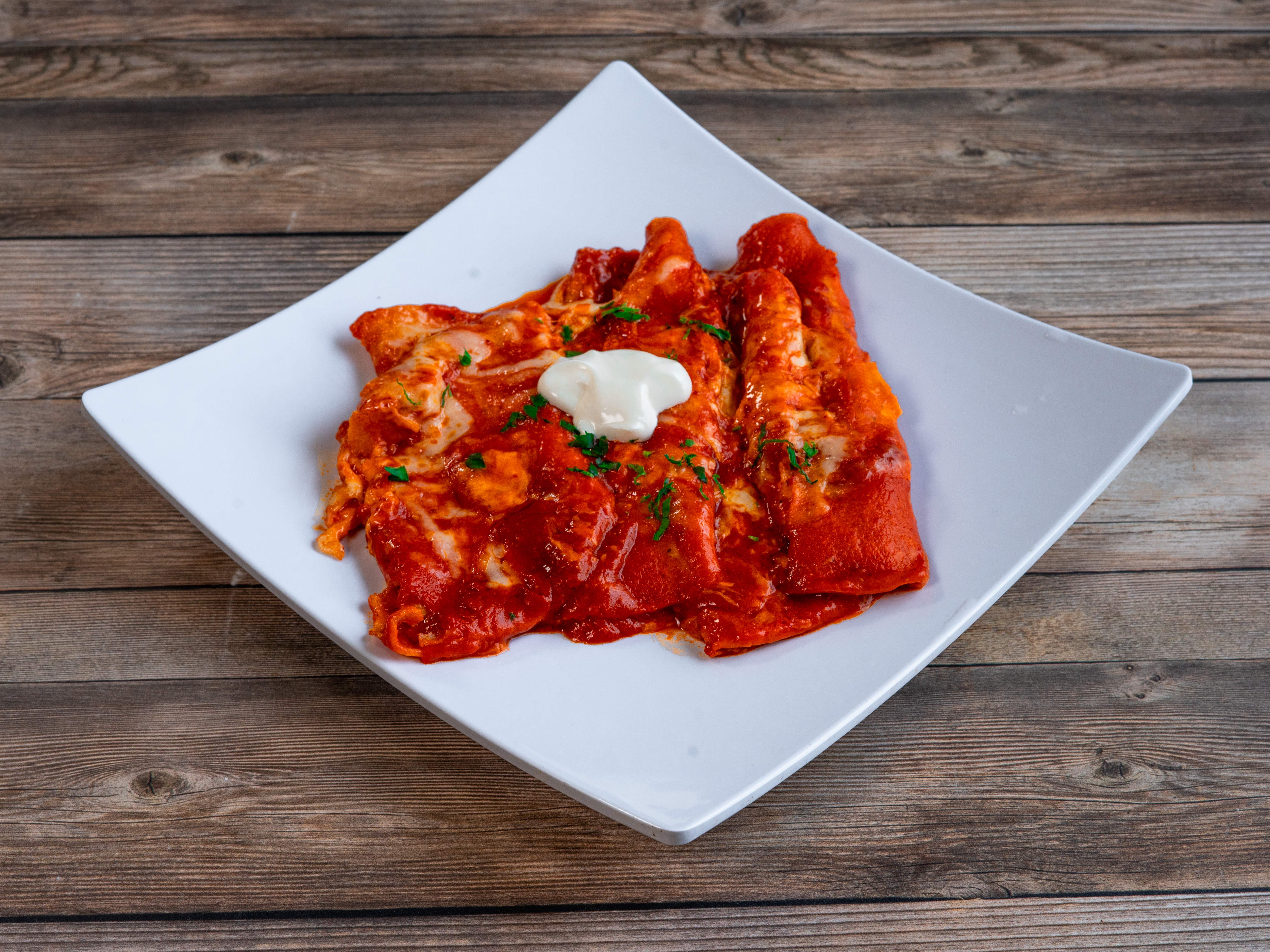 Order Famous Baked Cheese Enchiladas food online from La Morena Restaurant & Cantina store, El Paso on bringmethat.com