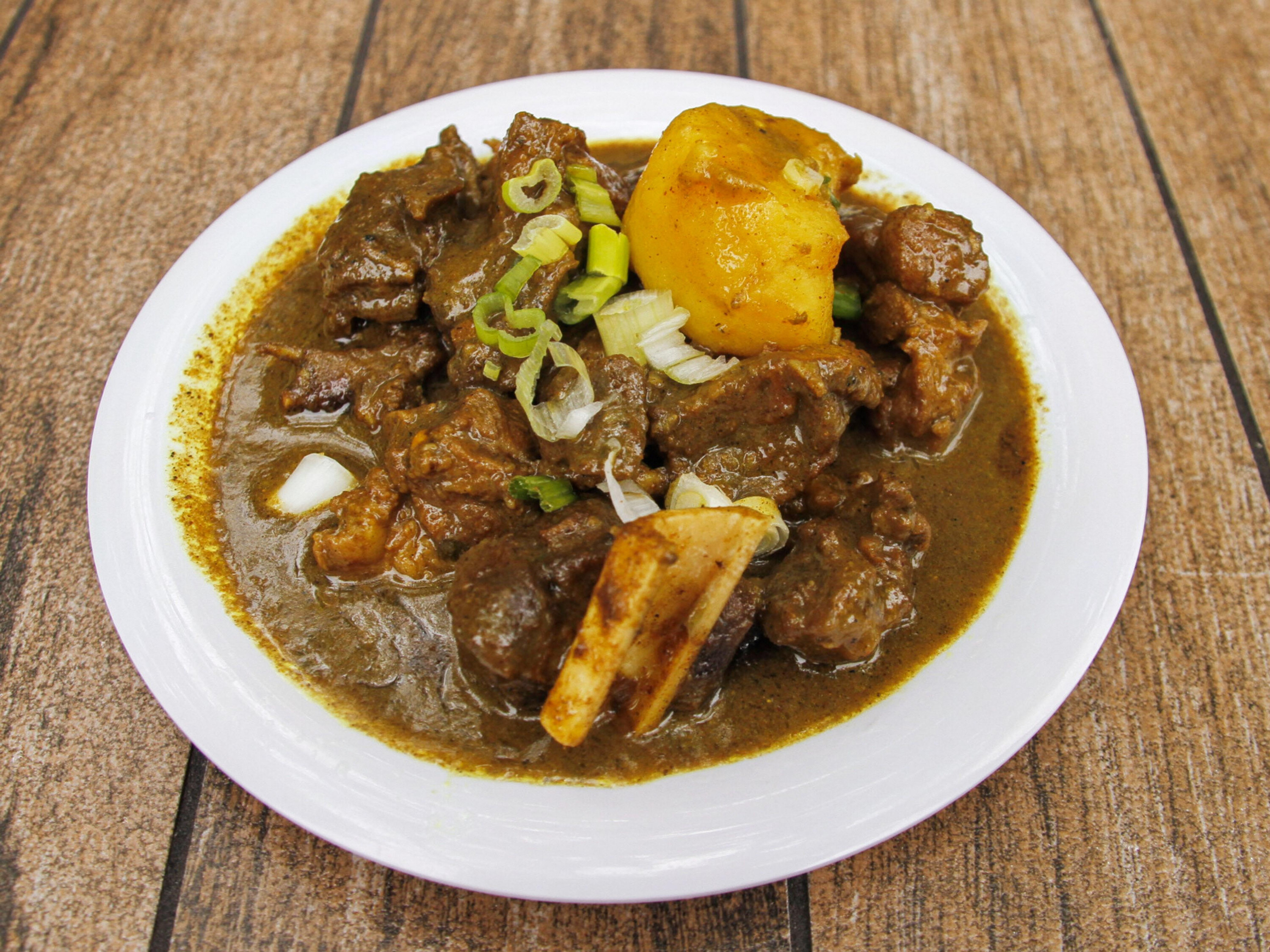 Order Curry Goat food online from Kaieteur Restaurant & Bakery store, Bronx on bringmethat.com