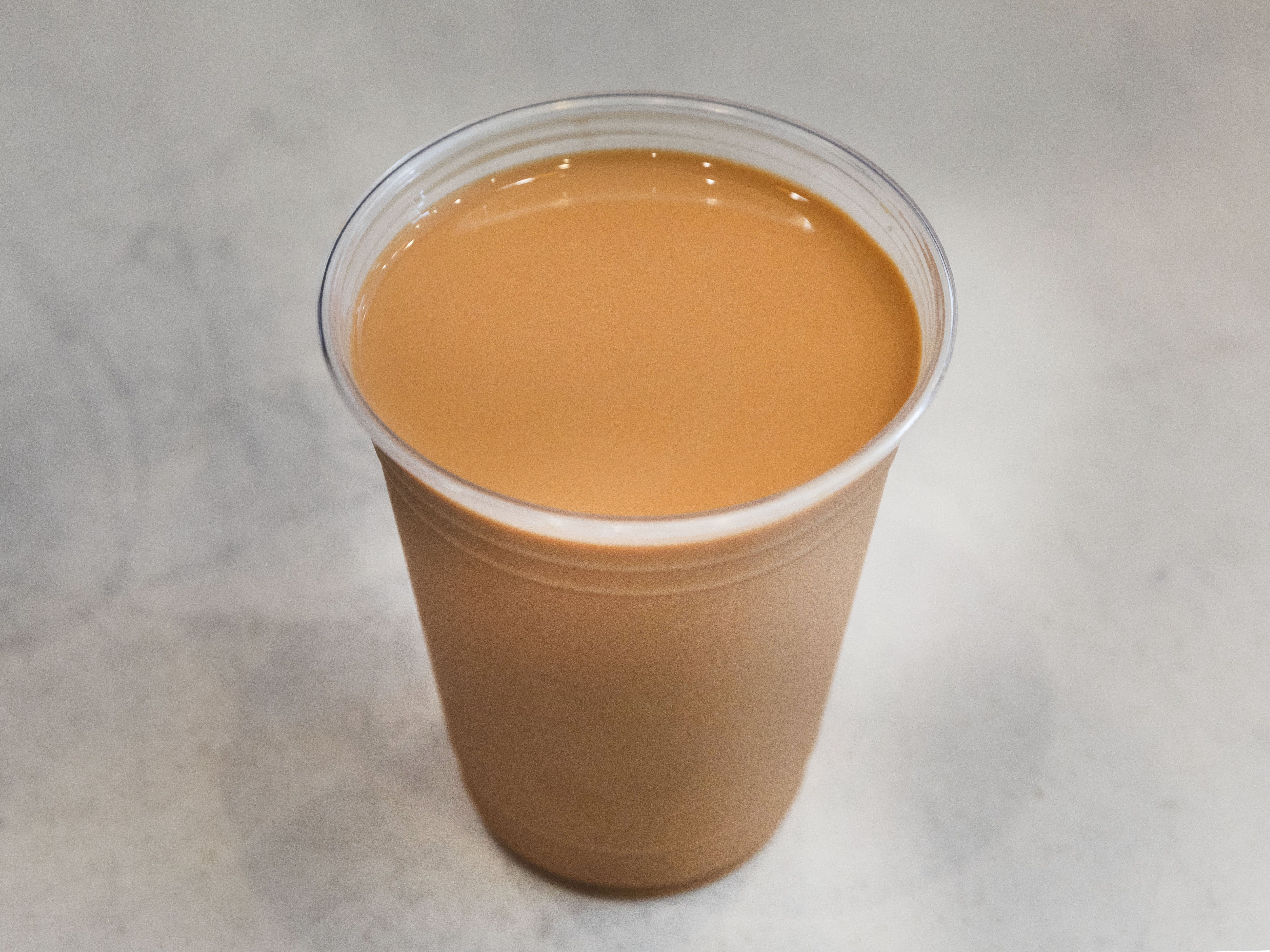 Order Ice Chilled Hong Kong Style Milk Tea 冰鎮奶茶 food online from Pineapple King Bakery store, San Francisco on bringmethat.com