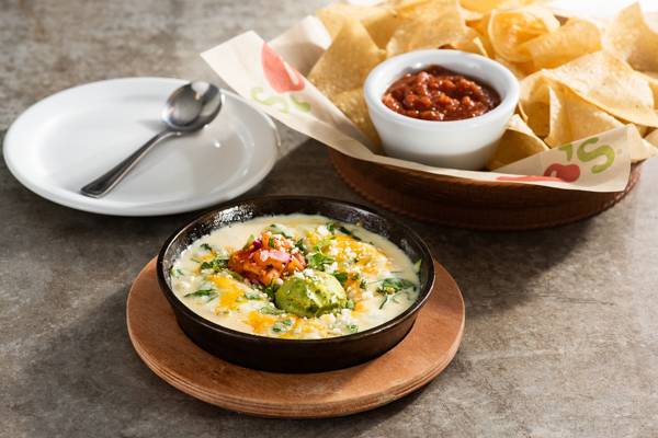 Order White Spinach Queso food online from Chilis store, Highlands Ranch on bringmethat.com