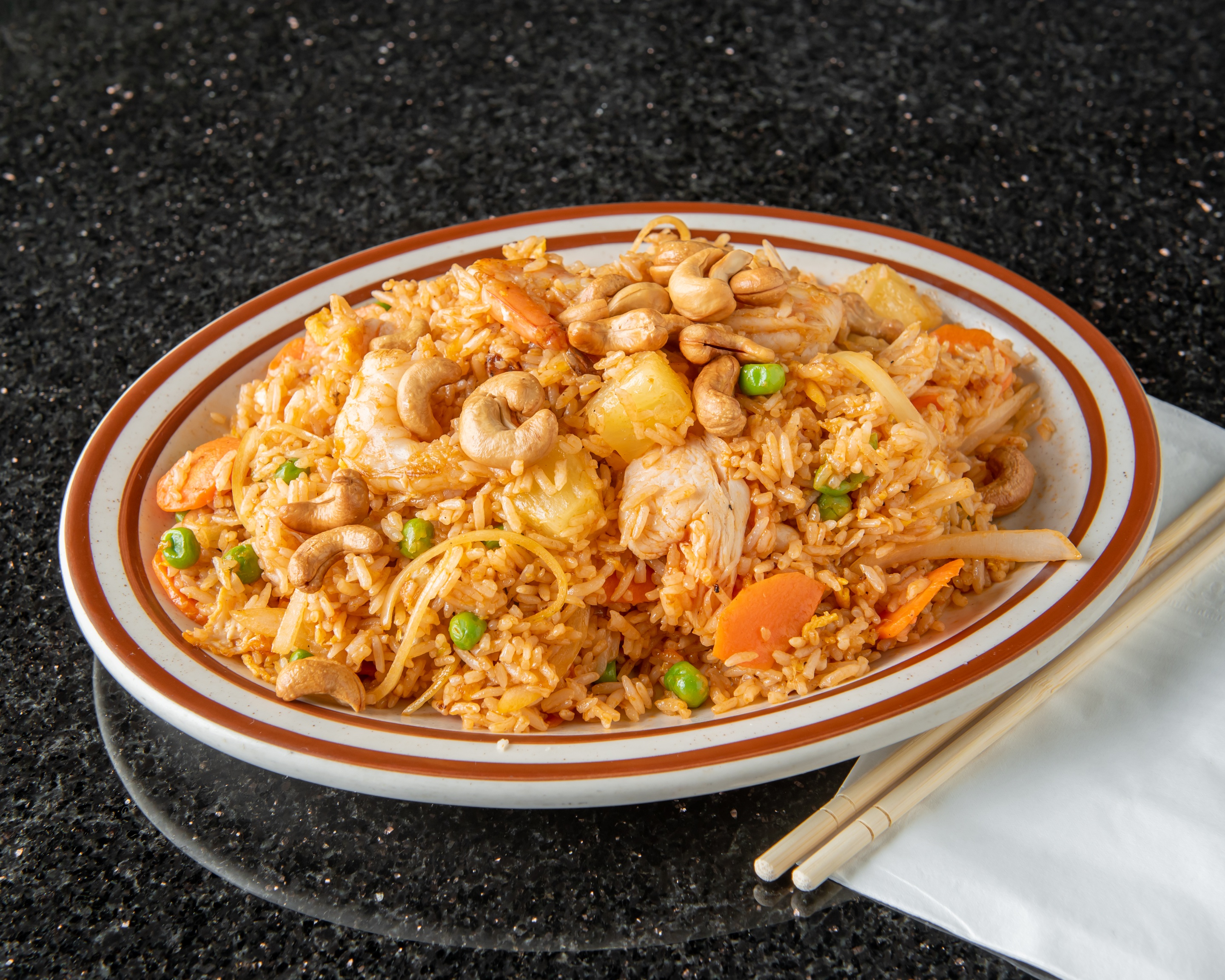 Order 27. Pineapple Fried Rice food online from Thai Noodles Cafe store, Libertyville on bringmethat.com