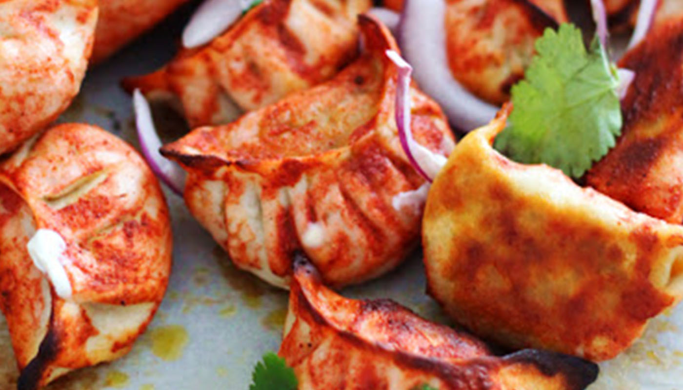 Order Sizzling Tandoori Momo with house special noodles (Veg-10pcs) food online from Momo King store, Mountain View on bringmethat.com
