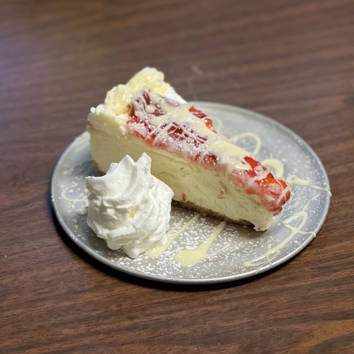 Order Strawberry White Chocolate  Cheesecake food online from Remington store, Beltsville on bringmethat.com