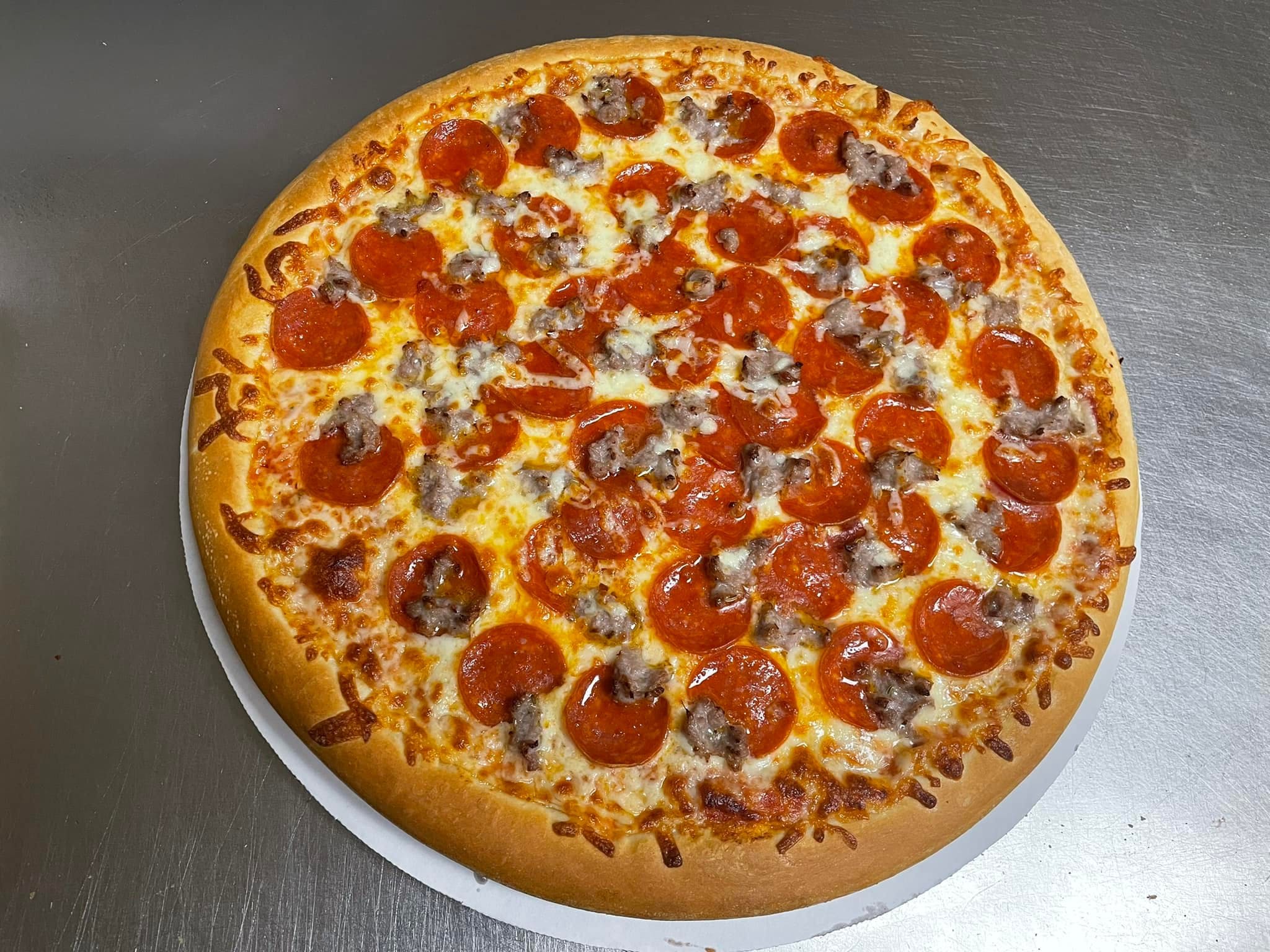 Order Cheese Pizza with Three Toppings - Small food online from Dmarie Pizza store, Plainville on bringmethat.com