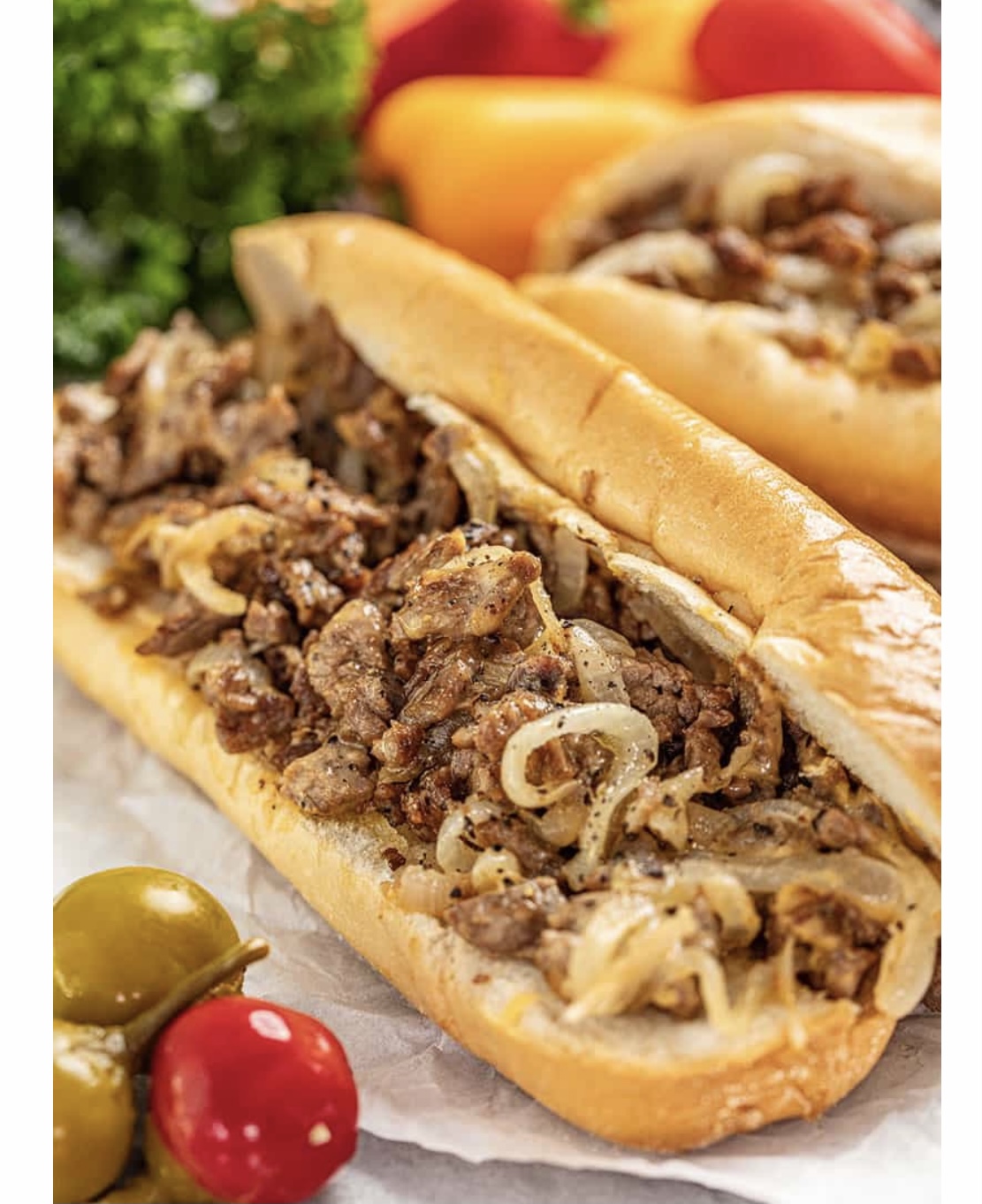 Order Philly Cheese Steak peppers onions hero food online from United Gourmet Deli store, New Rochelle on bringmethat.com