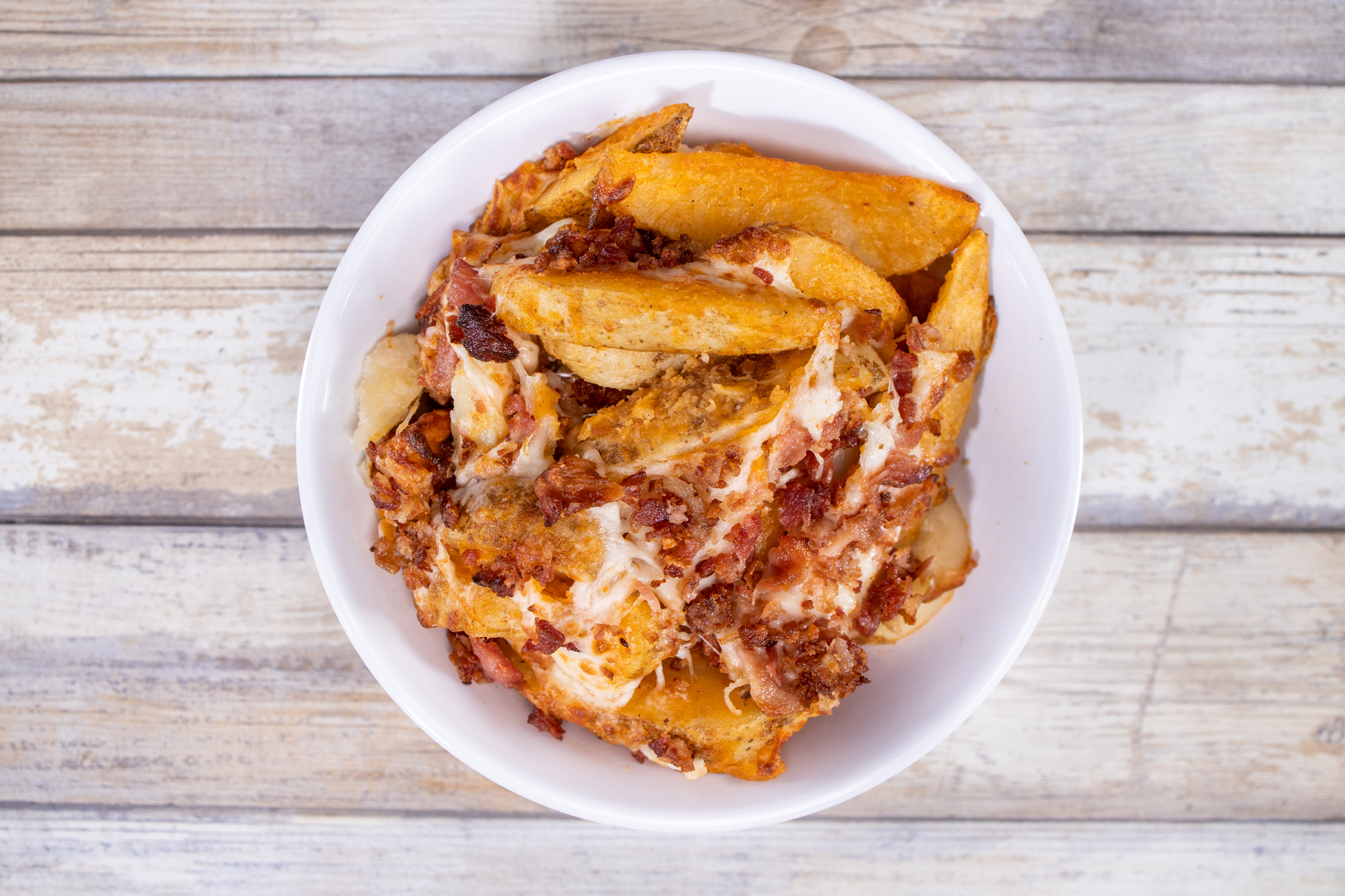 Order Potato Wedges with Cheese and BB food online from Chino Hills Pizza Co. store, Chino on bringmethat.com