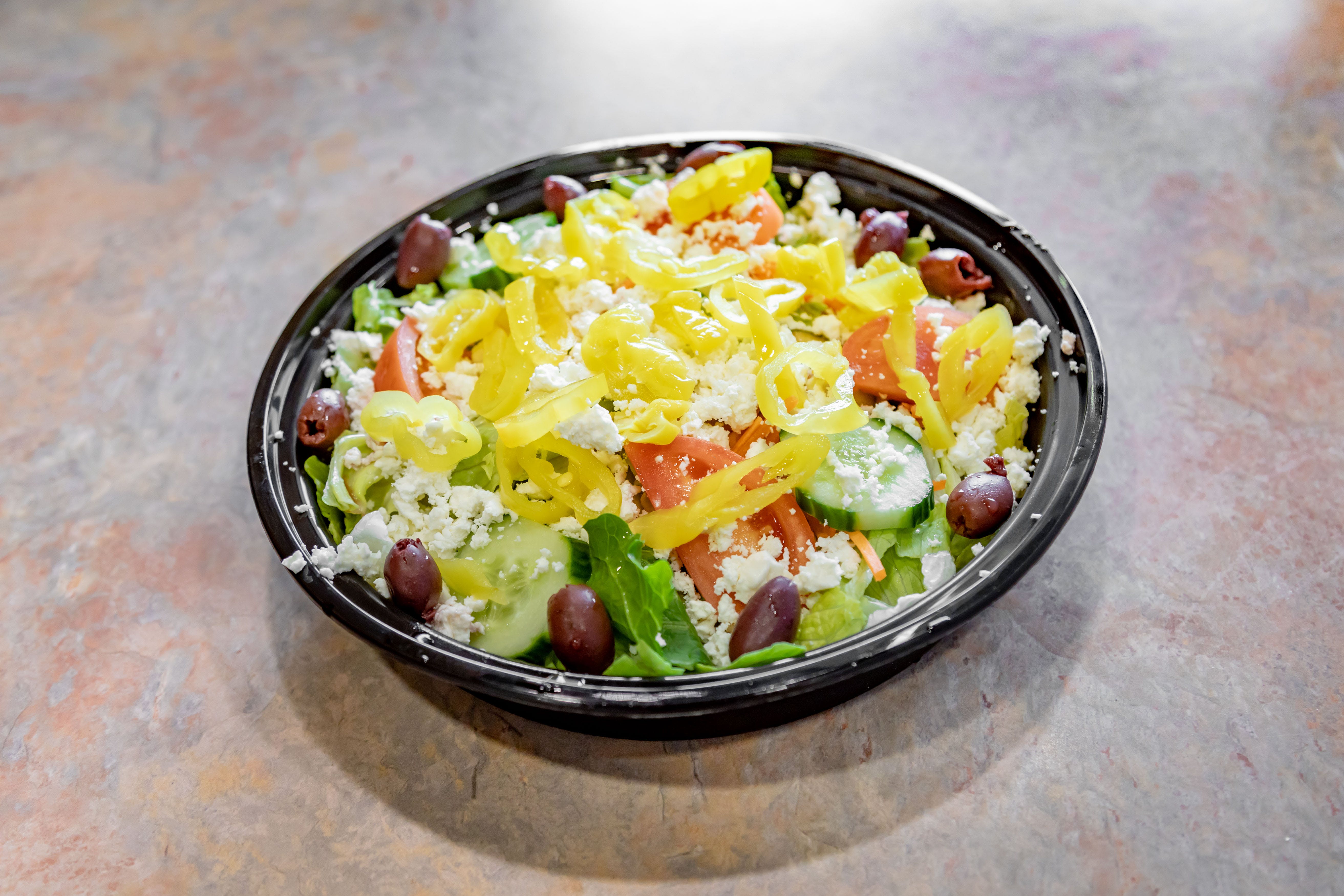 Order Greek Salad - Greek Salad food online from Bruno's Pizza store, Springfield on bringmethat.com
