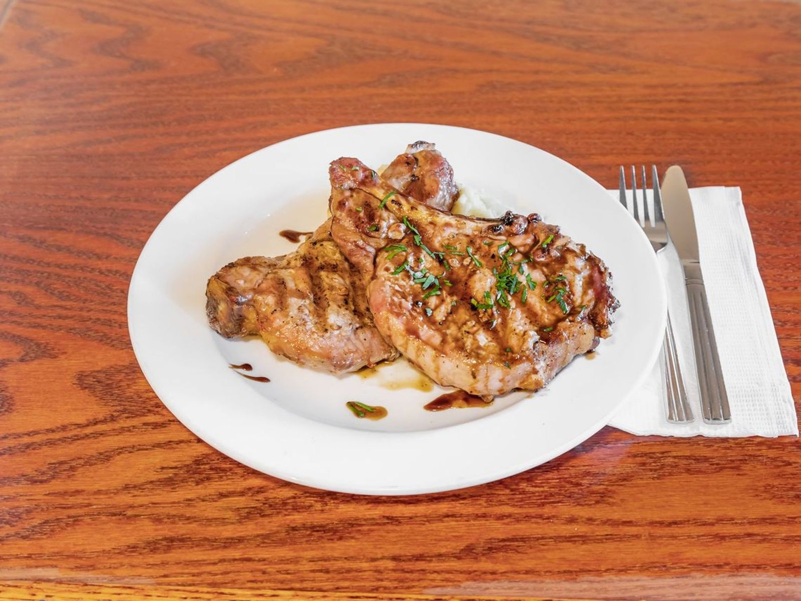 Order Broiled Pork Chop  food online from Bus stop cafe store, New York on bringmethat.com