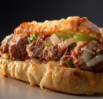 Order Meatball Parmigiana Sub - Small 10" food online from Tom's Pizza Pasta and Subs store, Springfield on bringmethat.com