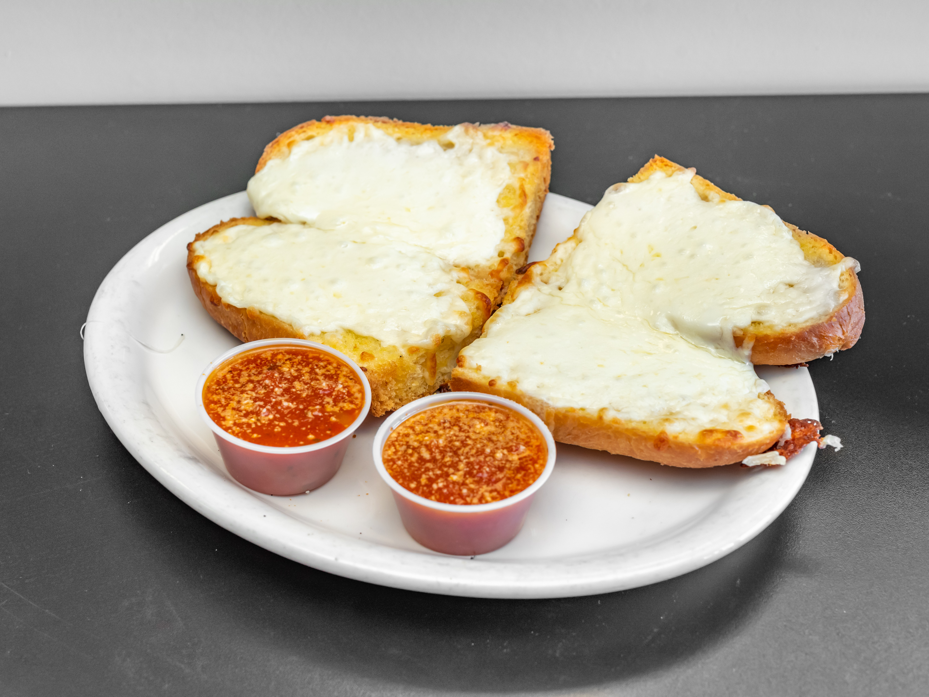 Order Garlic Cheese Bread food online from Tonti's Pizzeria store, Parker on bringmethat.com