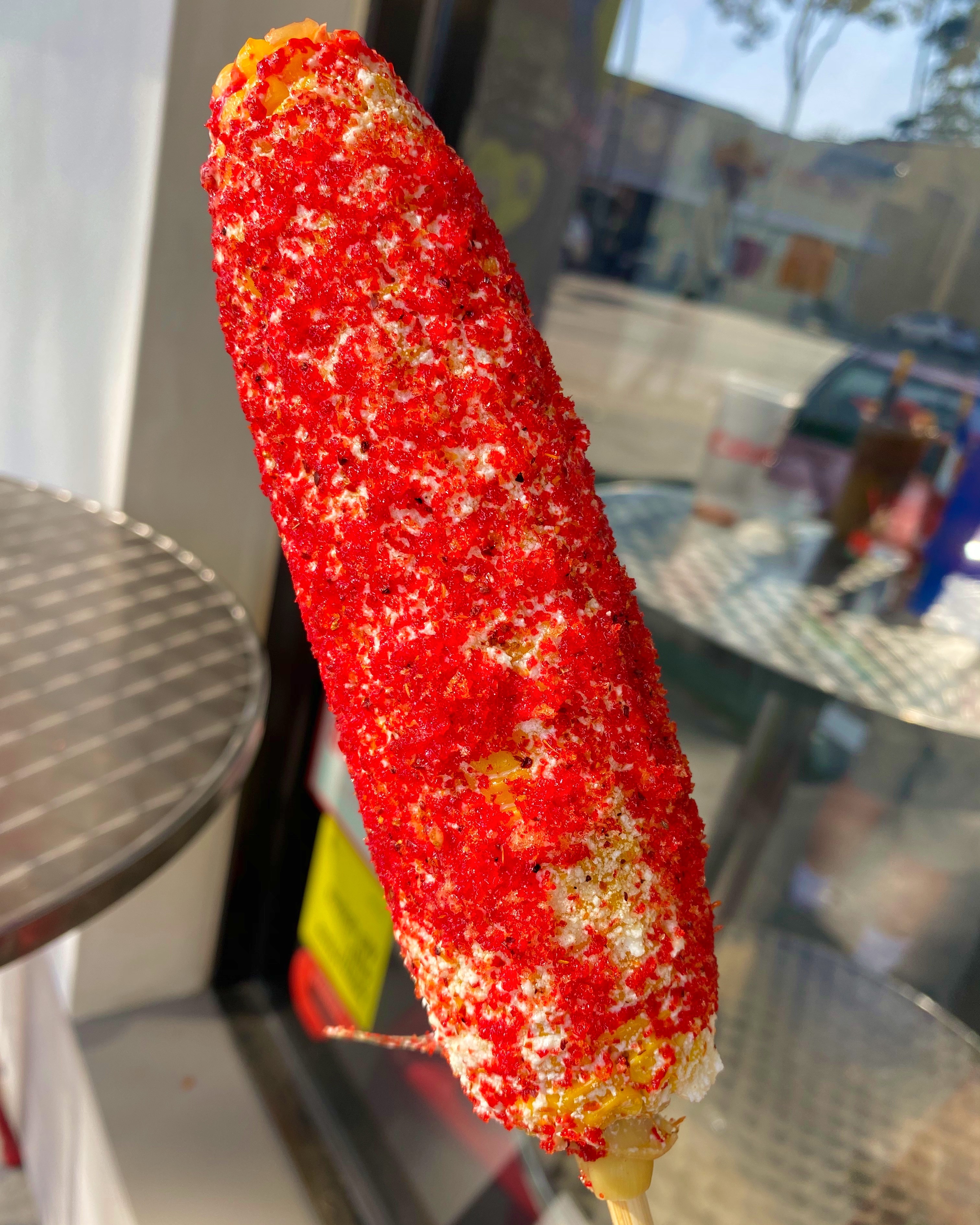 Order Elote with Hot Cheetos food online from El Munchies store, Glendale on bringmethat.com