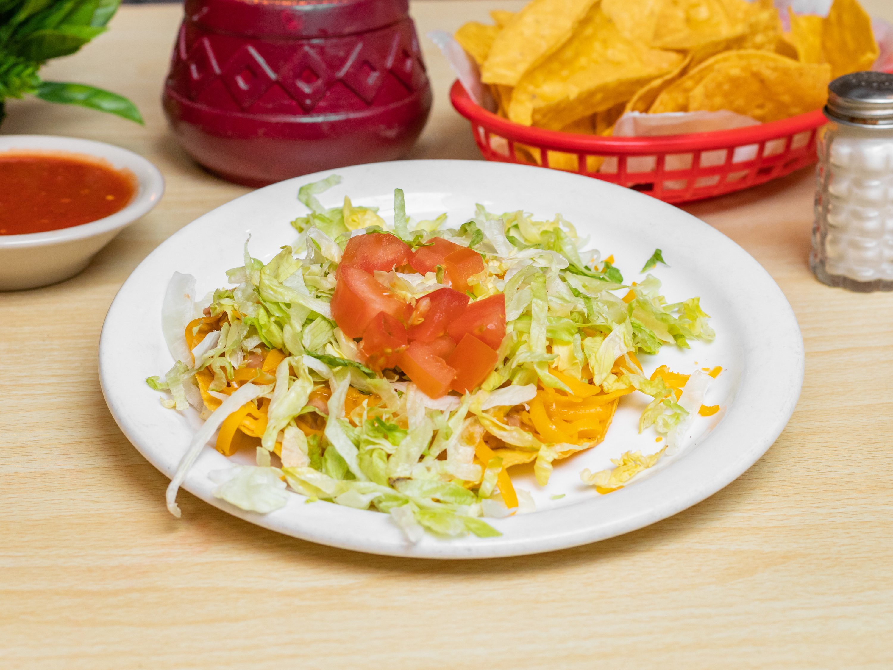 Order Beef Tostada food online from Alberto Mexican Restaurant store, Greeley on bringmethat.com