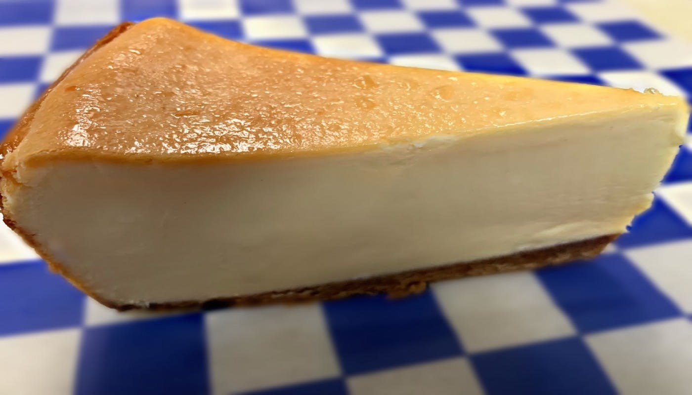 Order New York Style Cheesecake - Dessert food online from Village Pizza & Seafood store, Dickinson on bringmethat.com